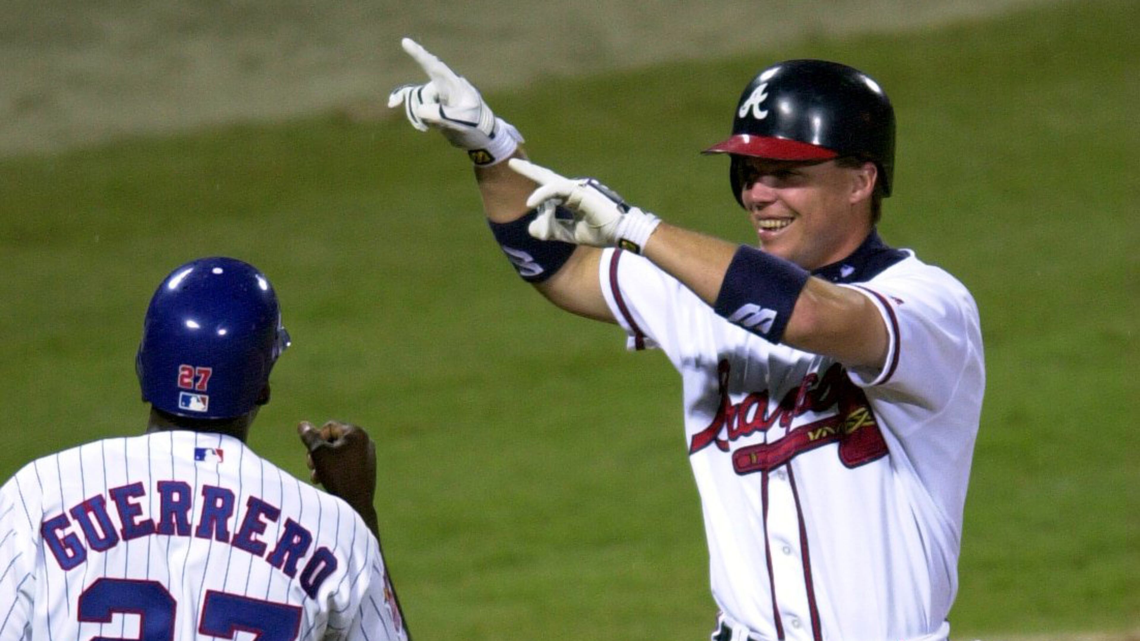 000711 - ATLANTA, GA.: Chipper Jones celebrates his home run with NL teammate Vladimir Guerrero in the third inning Tuesday evening, 7/11/00 at Turner Field in Atlanta in the All-Star Game. (PHOTO BY FRANK NIEMEIR/STAFF)