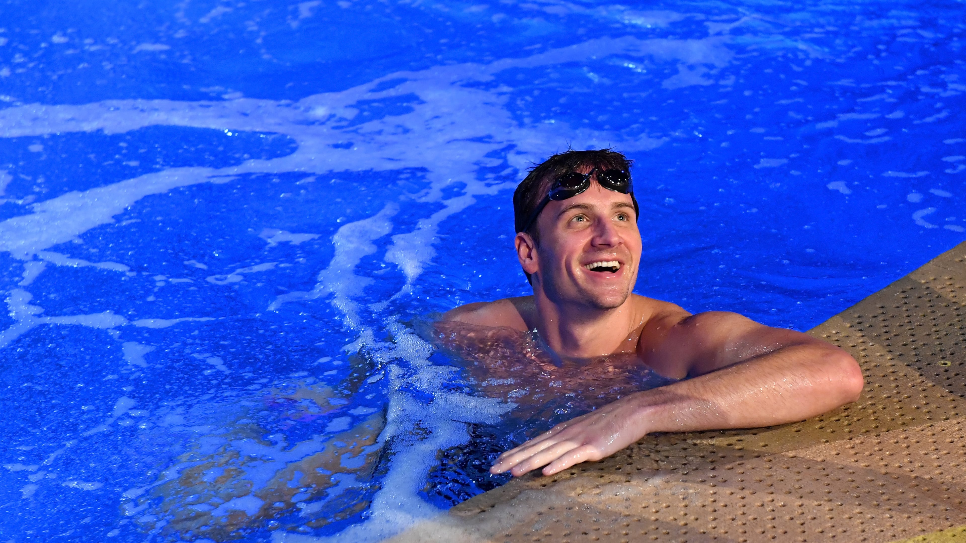 LAS VEGAS, NV - SEPTEMBER 30: Olympian Ryan Lochte swims in the pool at the 'O' theater as he and dancer Cheryl Burke rehearse for their 'Dancing with the Stars' performance with the cast of 'O by Cirque du Soleil' at the Bellagio on September 30, 2016 in Las Vegas, Nevada. (Photo by Ethan Miller/Getty Images for Cirque du Soleil)