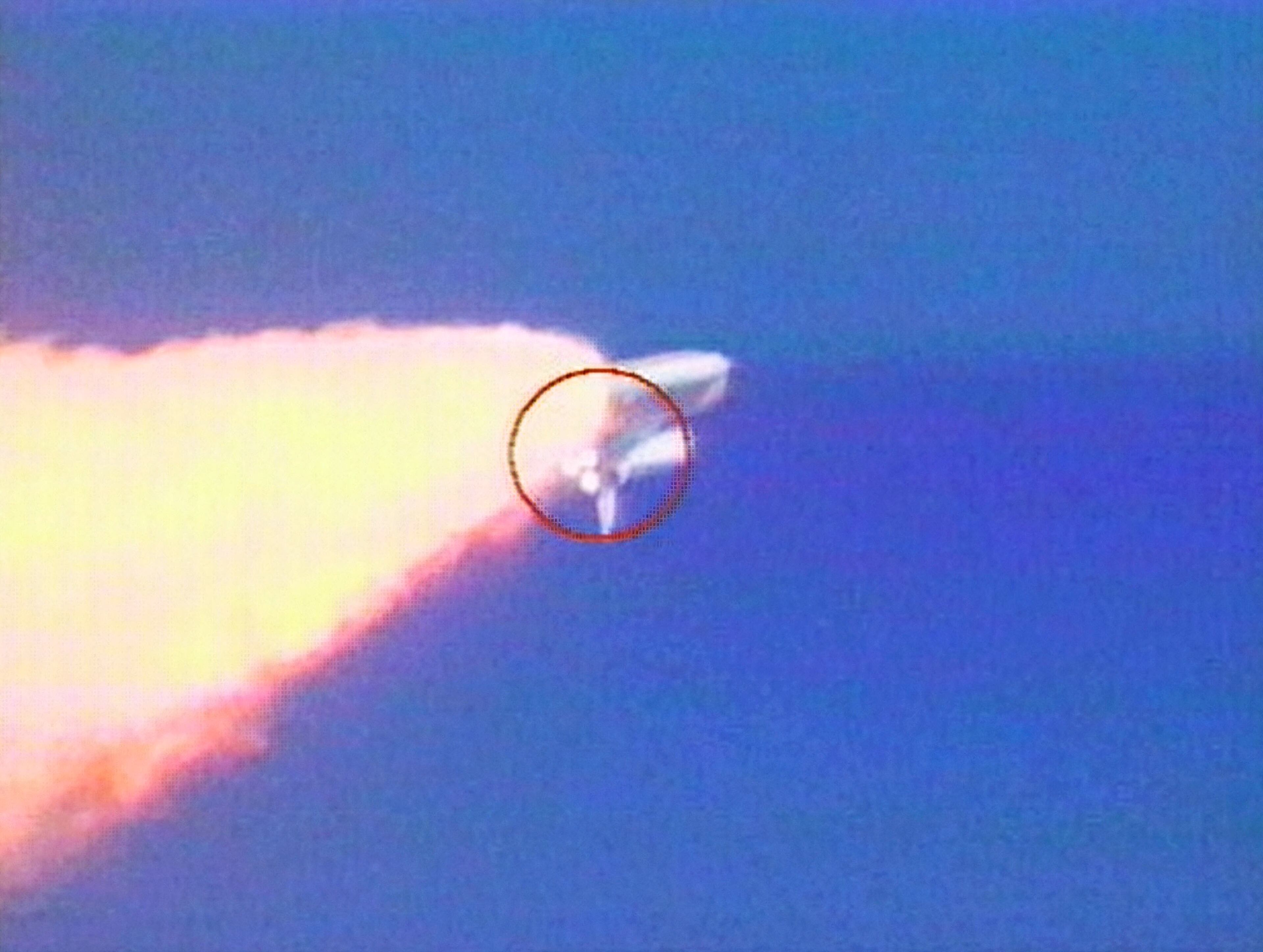 CAPE CANAVERAL, FL - JANUARY 16: (VIDEO CAPTURE) (Frame 1 of 2 in series) In this image from video an object is visible falling from the Space Shuttle Columbia during liftoff on January 16, 2003 from the Kennedy Space Center, at Cape Canaveral, Florida. The area on the Shuttle from which the object fell is highlighted in the red circle near the shuttle's main engines. (Photo by NASA-TV/Getty Images)