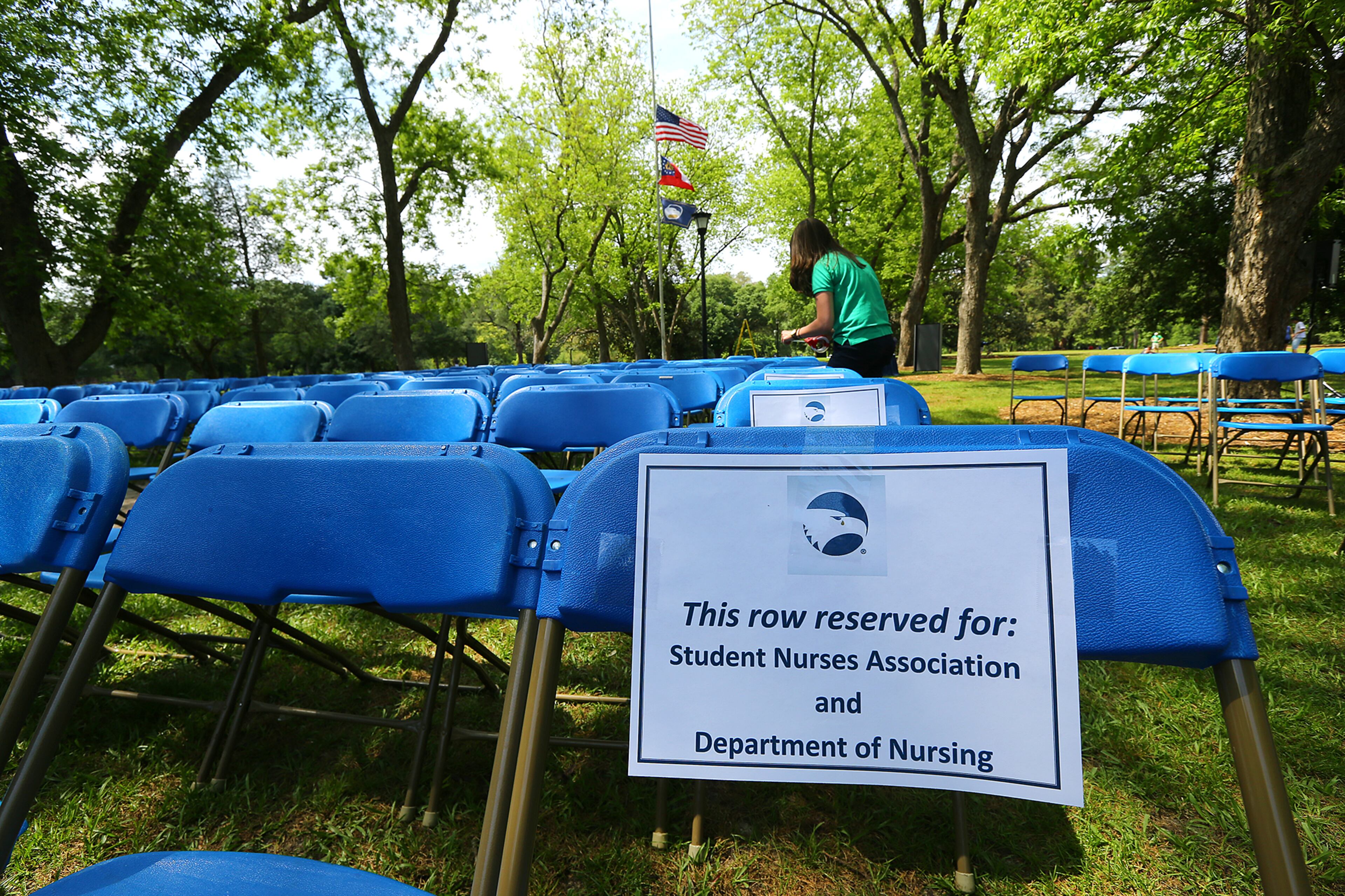 The flags fly at half-staff at Georgia Southern University where Kendra Ritter designates chairs for the Student Nurses Association and Department of Nursing at the Memorial Service site on Sweetheart Circle for those students whose lives were tragically lost on Thursday, April 23, 2015, in Statesboro. Curtis Compton / ccompton@ajc.com