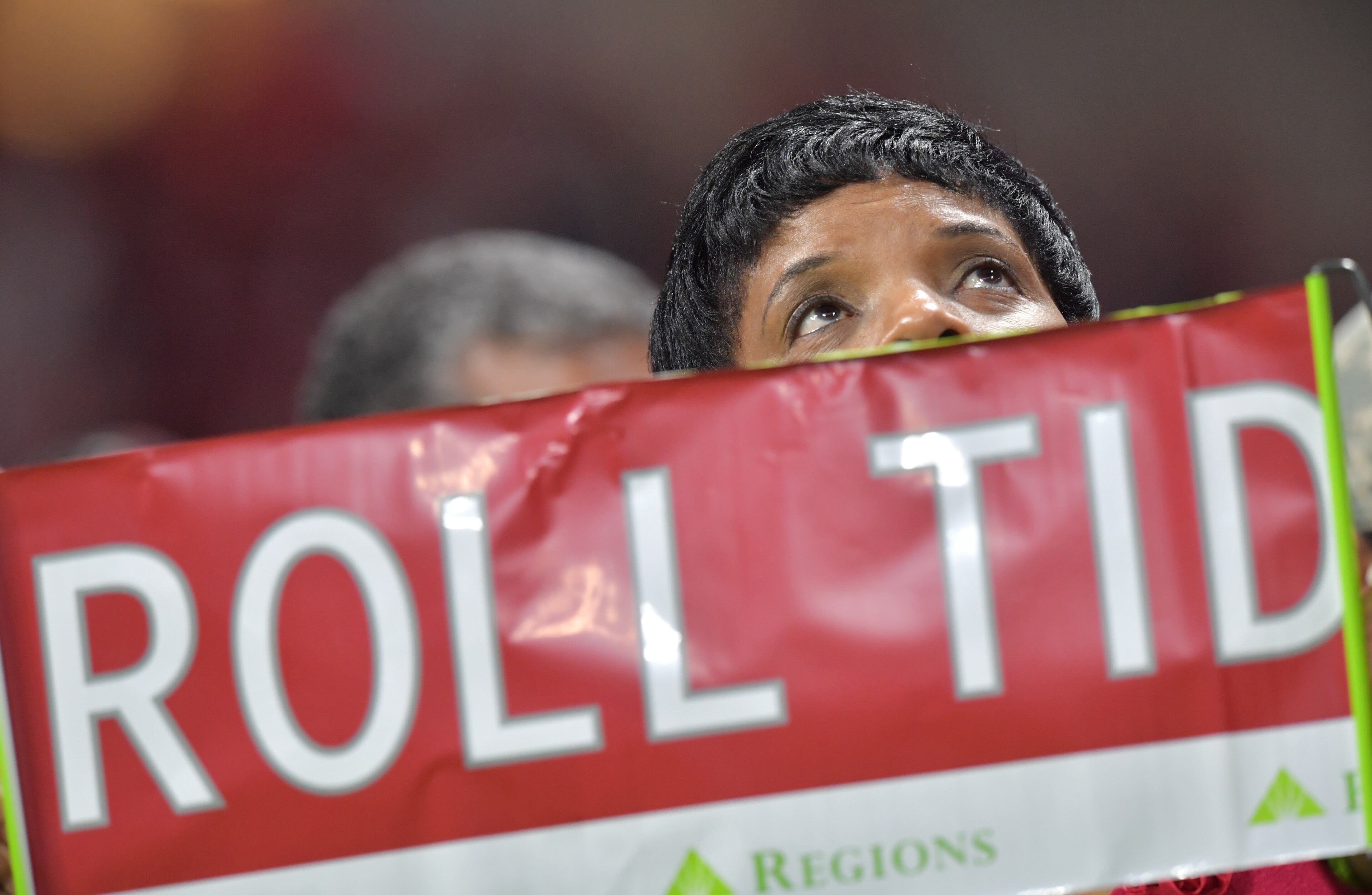 December 1, 2018 Atlanta - An Alabama fan holds a banner during the second half of the SEC Football Championship at Mercedes-Benz Stadium on Saturday, December 1, 2018. Alabama won 35-28 over the Georgia. HYOSUB SHIN / HSHIN@AJC.COM
