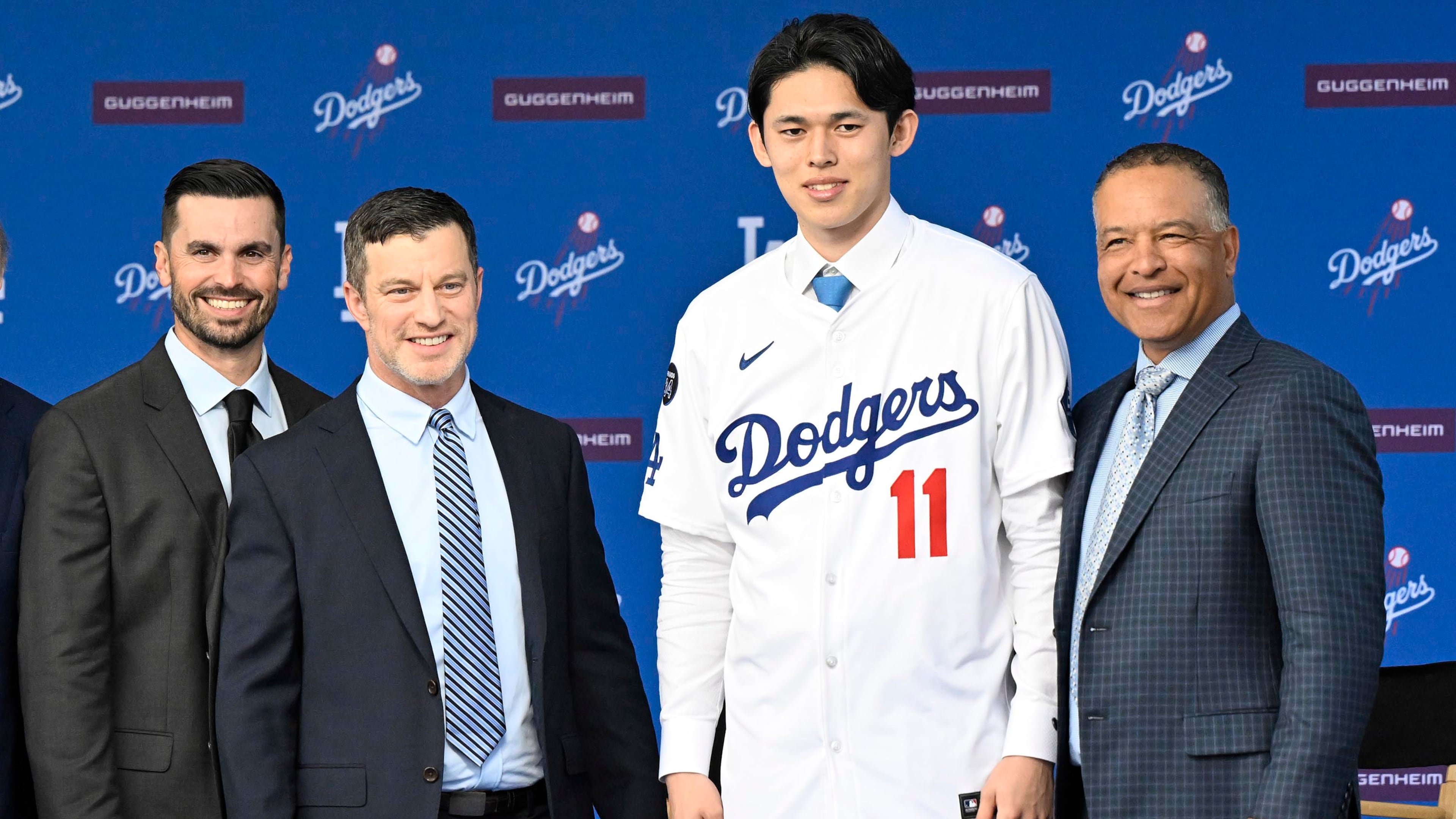 Japanese pitcher Roki Sasaki poses with Los Angeles Dodgers general manager Brandon Gomes, far left, Dodgers president of baseball operations Andrew Friedman, second from left, and Dodgers manager Dave Roberts, far right, as he is introduced as the newest Dodger during a news conference on Wednesday, Jan. 22, 2025, at Dodger Stadium in Los Angeles. (Keith Birmingham/Orange County Register/TNS)
