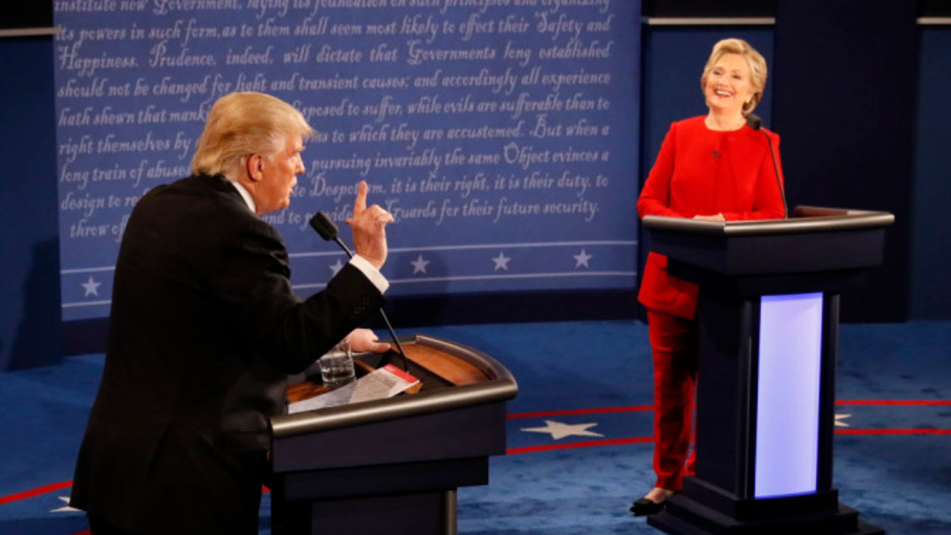 Democratic presidential nominee Hillary Clinton smiles as Republican presidential nominee Donald Trump speaks during the presidential debate at Hofstra University in Hempstead, N.Y., Monday, Sept. 26, 2016. (Rick T. Wilking/Pool via AP) ORG XMIT: NYDB527