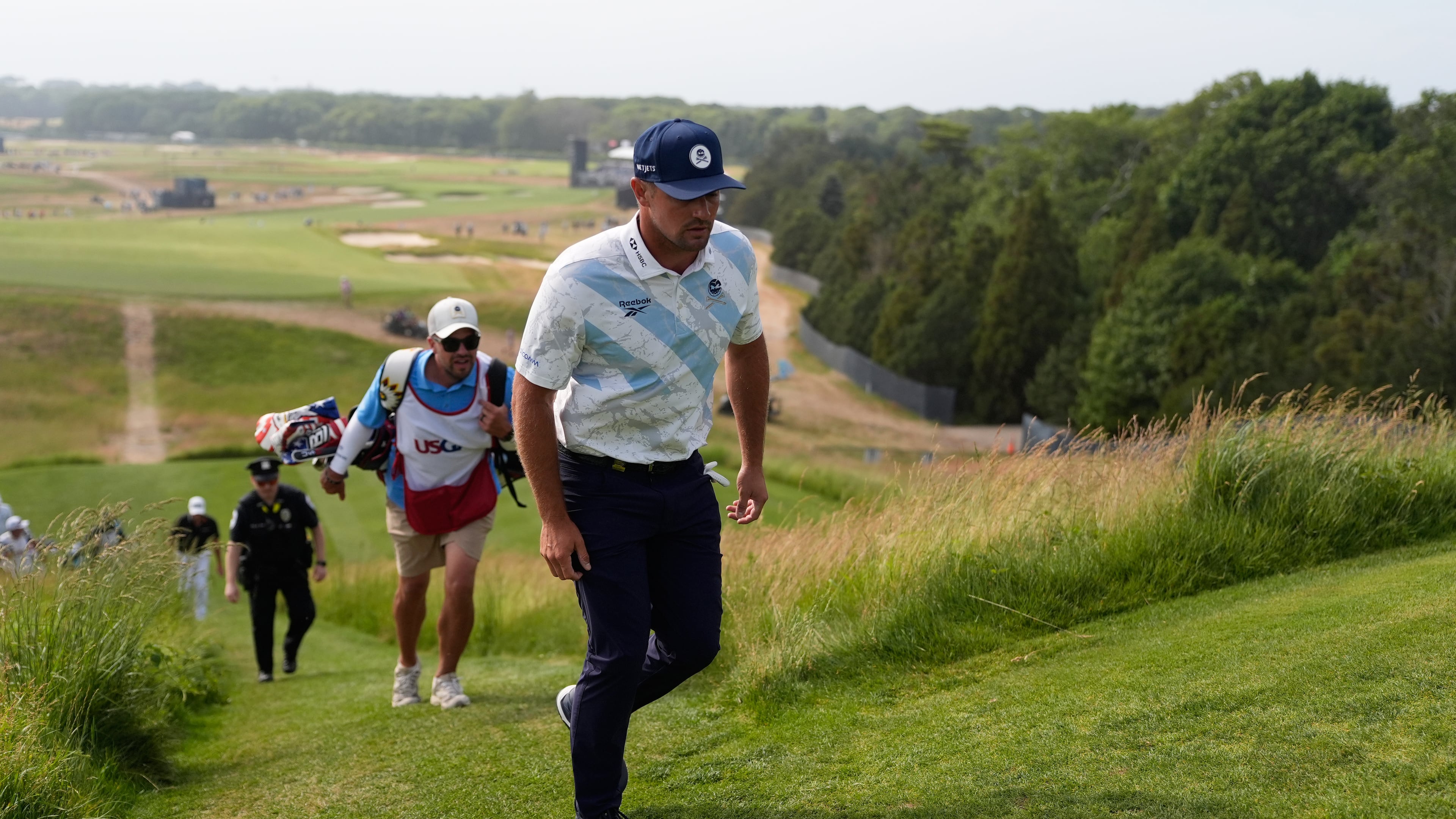 Bryson DeChambeau walks to the tee on the 15th hole during the first round of the U.S. Open golf tournament at Shinnecock Hills Golf Club in Southampton, N.Y., Thursday, June 18, 2026.(AP Photo/George Walker IV)