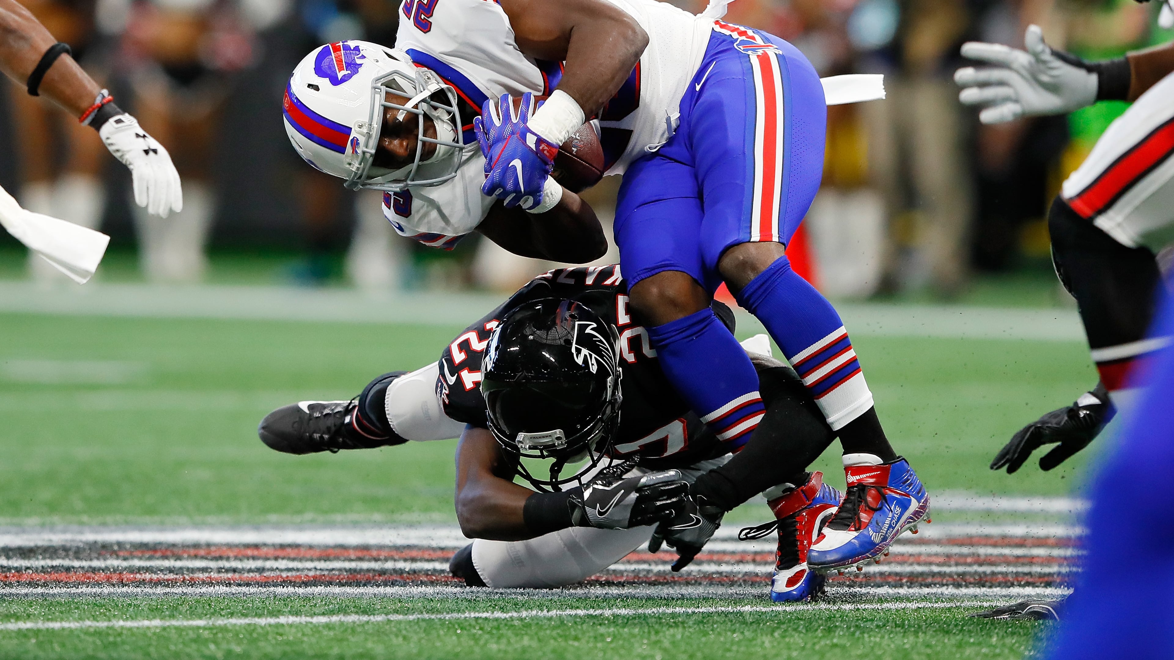 ATLANTA, GA - OCTOBER 01: LeSean McCoy #25 of the Buffalo Bills is tackled by Damontae Kazee #27 of the Atlanta Falcons during the first half at Mercedes-Benz Stadium on October 1, 2017 in Atlanta, Georgia. (Photo by Kevin C. Cox/Getty Images)
