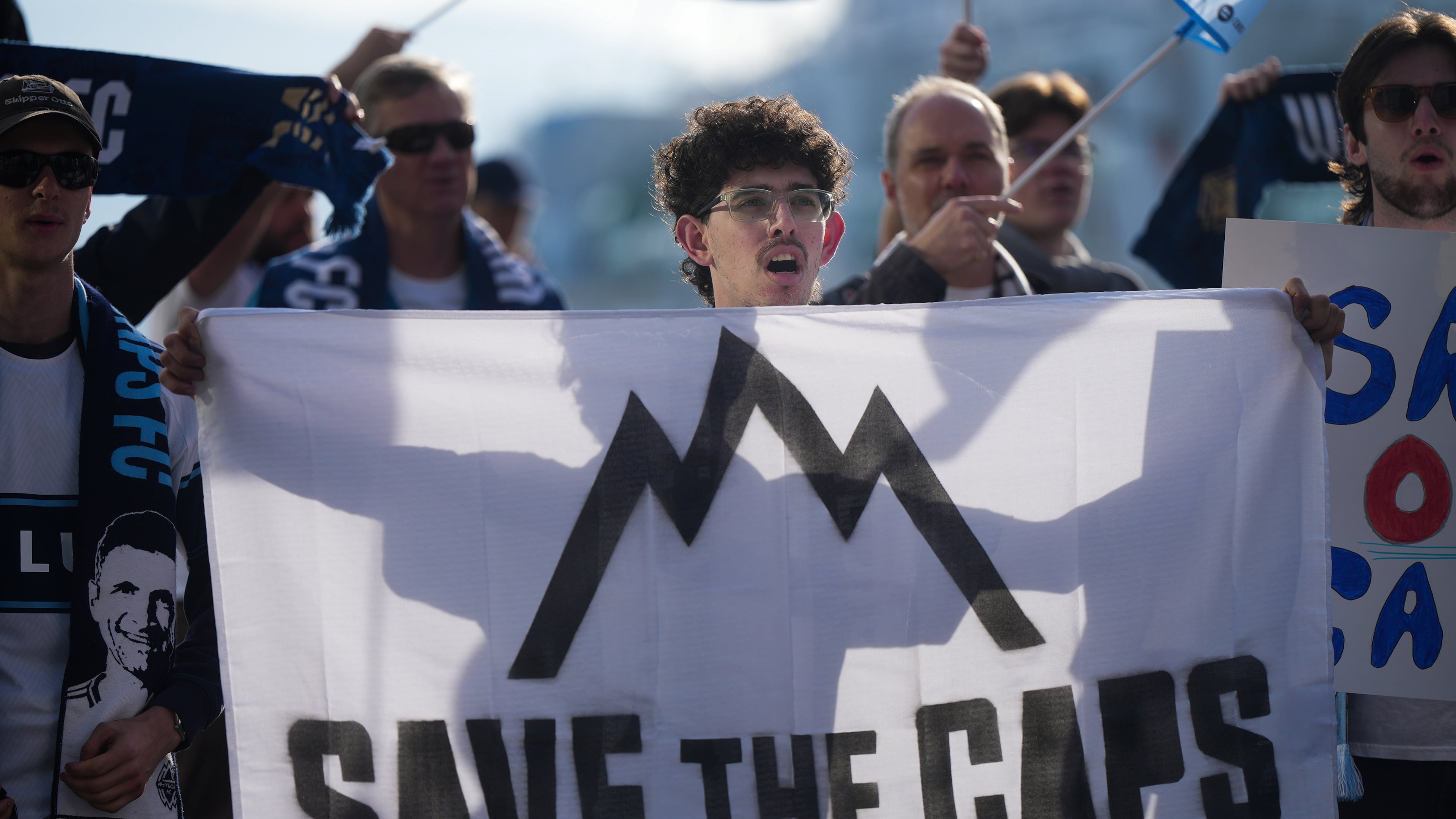 Fans of the Vancouver Whitecaps MLS soccer team rally to keep the team in Vancouver, Thursday, April 30, 2026, outside the 76th FIFA Congress in Vancouver, British Columbia. (Darryl Dyck/The Canadian Press via AP)