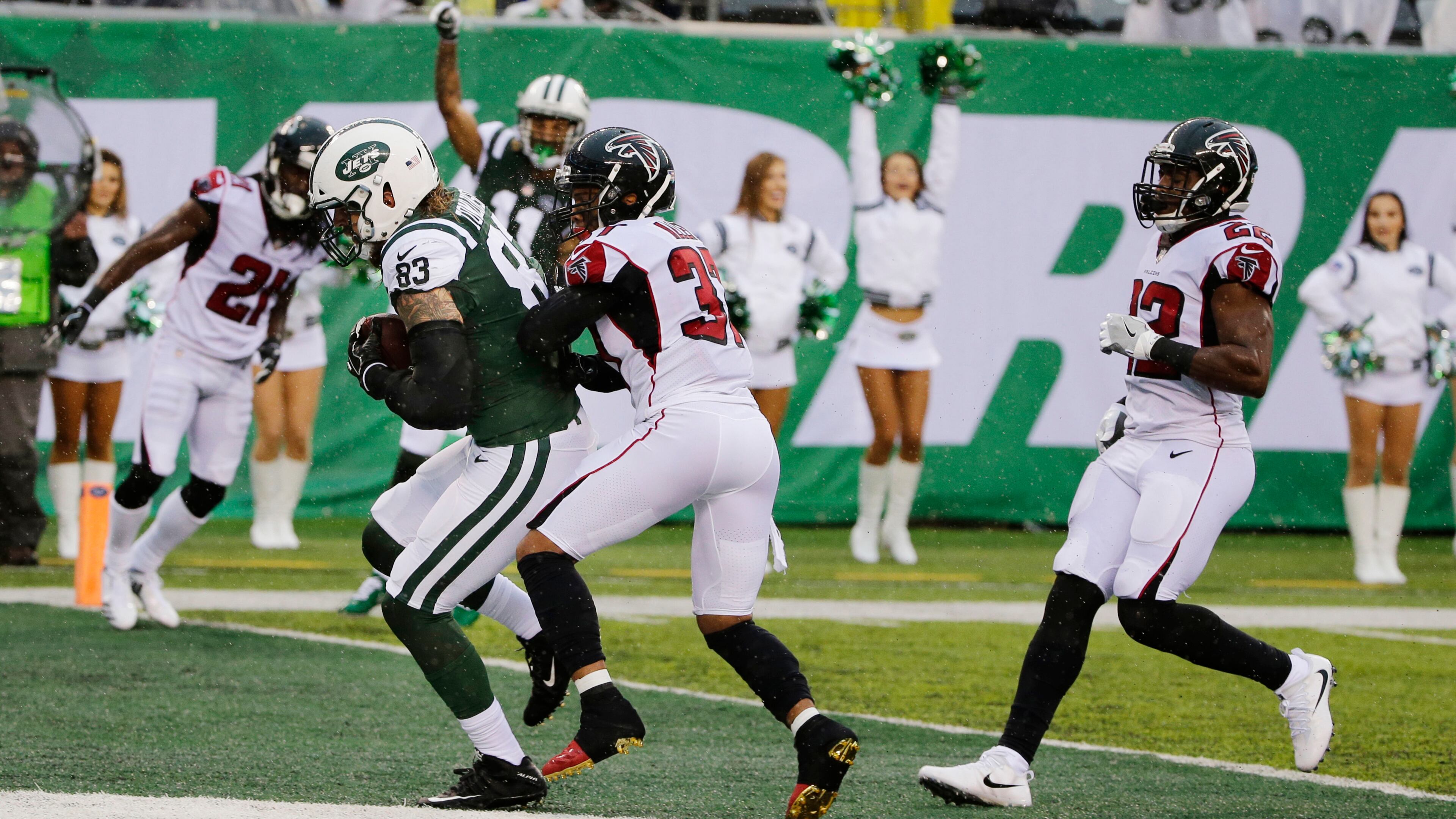 New York Jets tight end Eric Tomlinson (83) runs past Atlanta Falcons free safety Ricardo Allen (37) for a touchdown during the first half of an NFL football game Sunday, Oct. 29, 2017, in East Rutherford, N.J. (AP Photo/Seth Wenig)