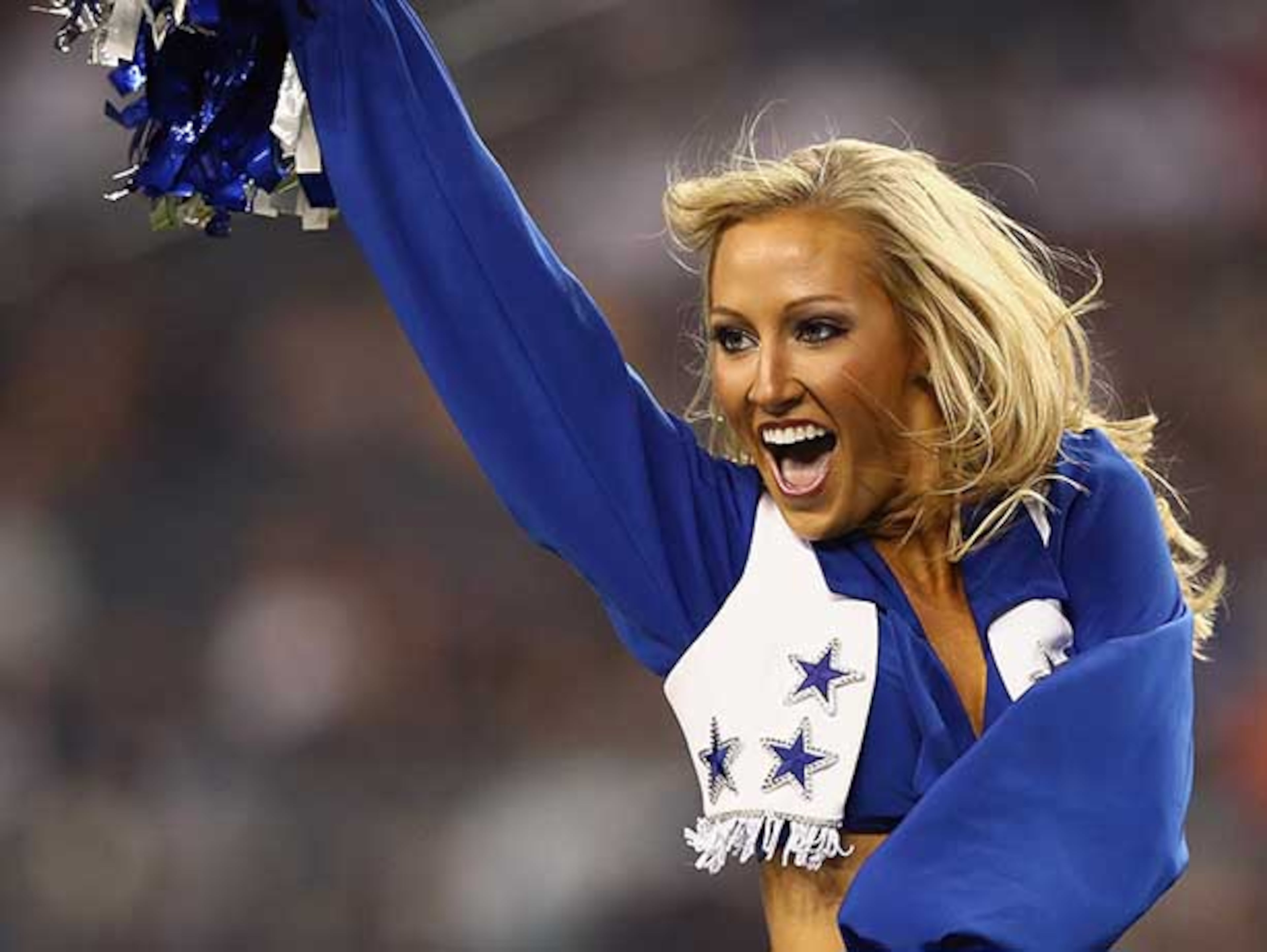 ARLINGTON, TX - AUGUST 24: A Dallas Cowboys Cheerleader performs during a preseason game at AT&T Stadium on August 24, 2013 in Arlington, Texas. (Photo by Tom Pennington/Getty Images)