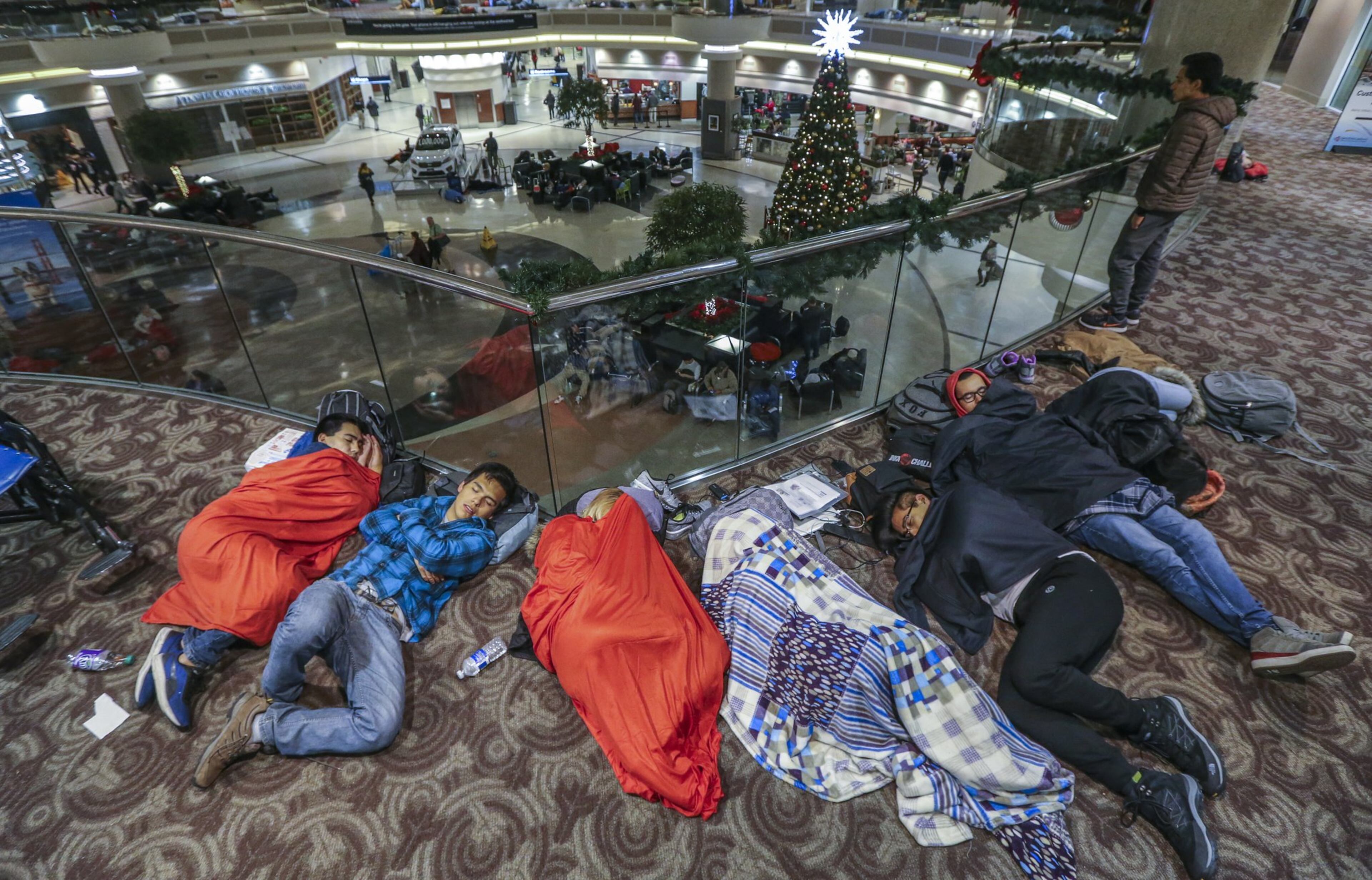 Passengers were still feeling the effects Monday of Sunday’s power outage at Hartsfield-Jackson Atlanta International Airport as they had to endure long lines to claim baggage and ride shuttles. BOB ANDRES /BANDRES@AJC.COM