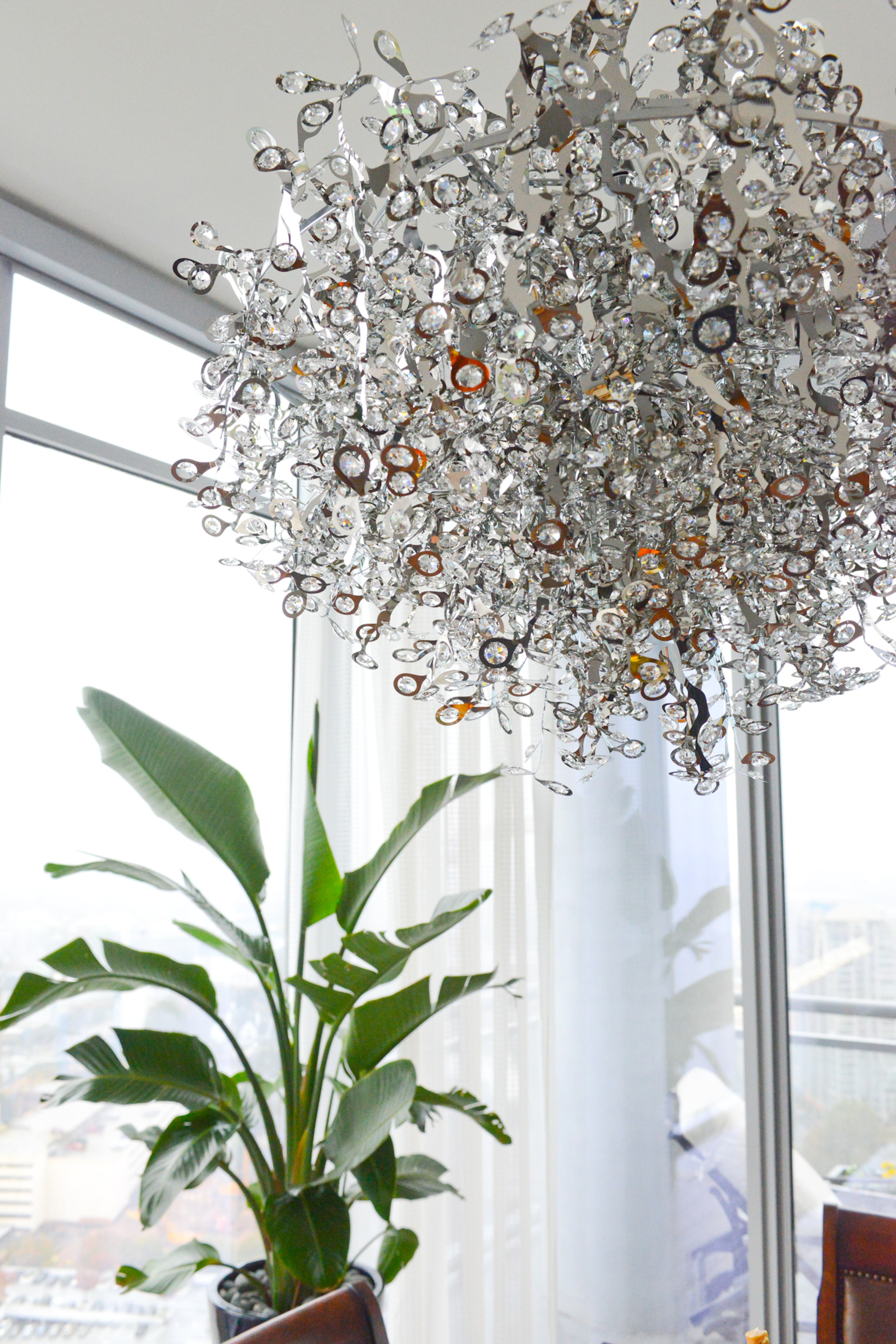 The chandelier in Jim Wilson's dining room, from Masterpiece Lighting, is one of the ways he says he brings a modern element into the condo.