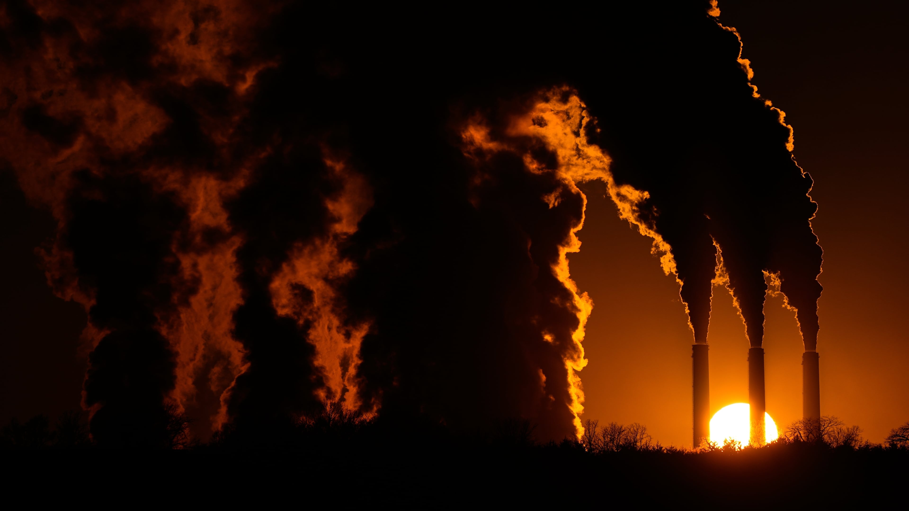 FILE - The Jeffrey Energy Center coal-fired power plant operates at sunset near Emmett, Kan., Jan. 3, 2026, in Topeka, Kan. (AP Photo/Charlie Riedel, file)