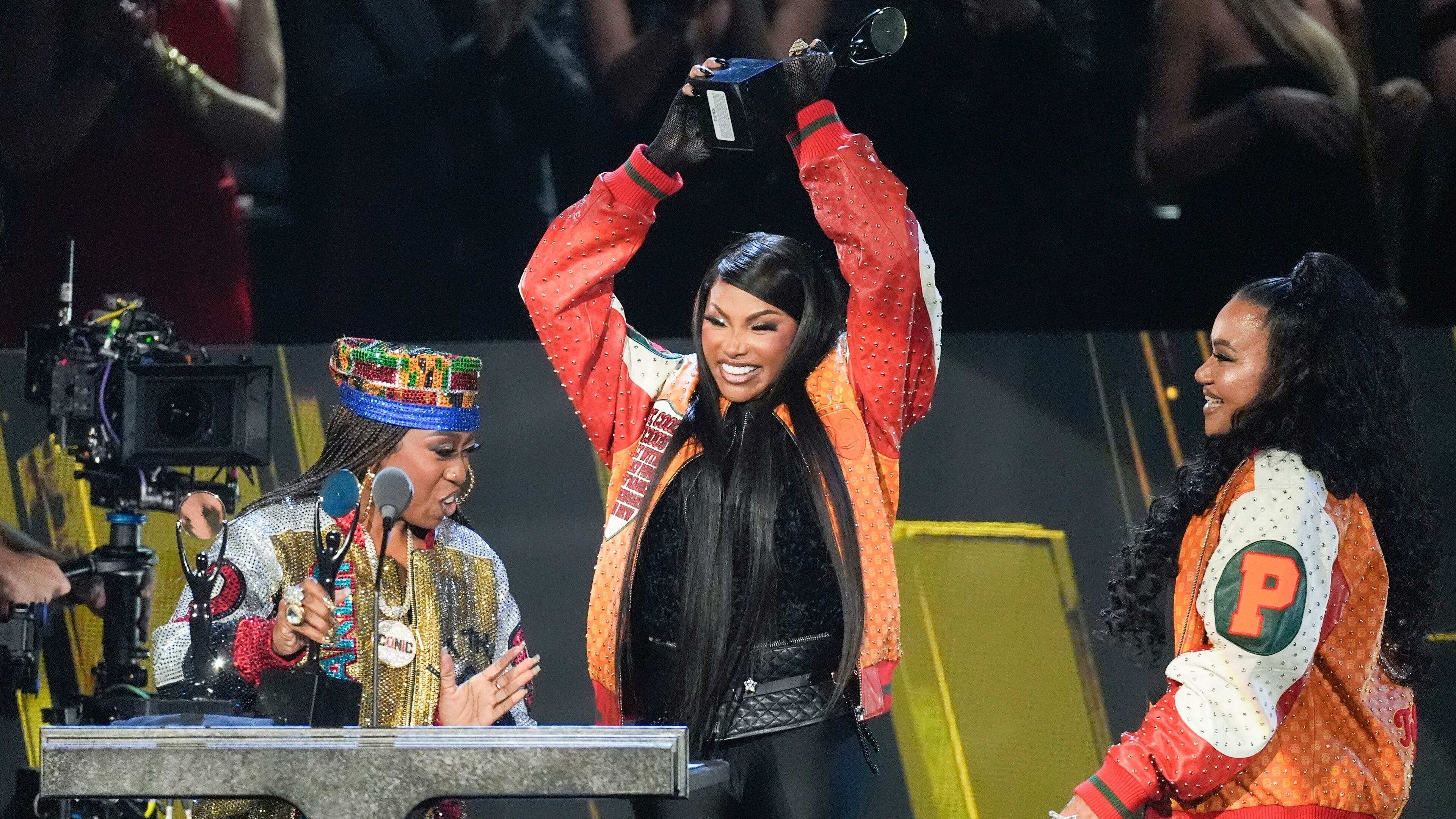 FILE - Missy Elliott, from left, and Sandra Denton with Cheryl James, right of Salt-N-Pepa, react during the 2025 Rock and Roll Hall of Fame Induction Ceremony on Nov. 8, 2025, at L.A. Live in Los Angeles. (AP Photo/Chris Pizzello, File)