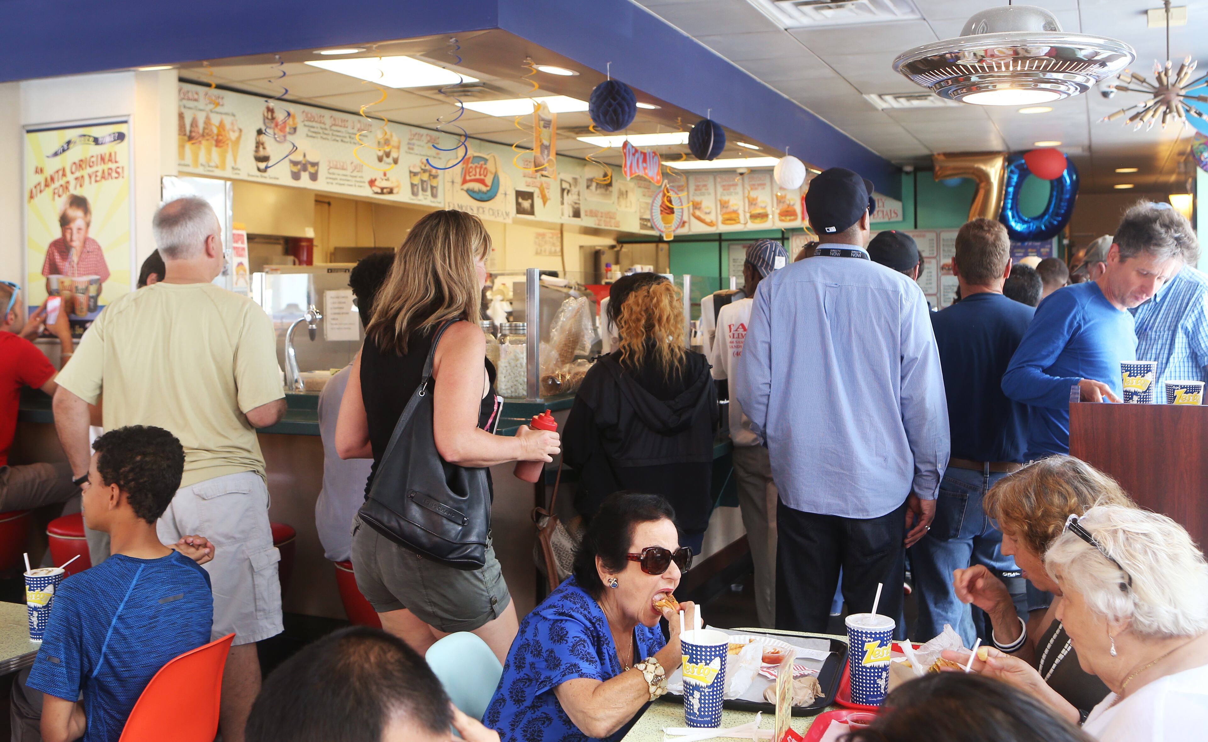 July 1, 2019 Buckhead- Customers order, eat and socialize during the 70th anniversary celebration for Zesto Atlanta at their Buckhead location off of Piedmont Road NE on Monday, July 1, 2019. Zesto opened in 1945 nationally, moving to Atlanta in 1949. The restaurant eventually had six locations in Atlanta, remaining family owned and operated through its expansion. Today there are four Zesto locations remaining in Atlanta. Zesto celebrated its 70th anniversary with 70 cent chili dogs for its customers, who packed the restaurant during the morning of the all-day celebration. Christina Matacotta/Christina.Matacotta@ajc.com