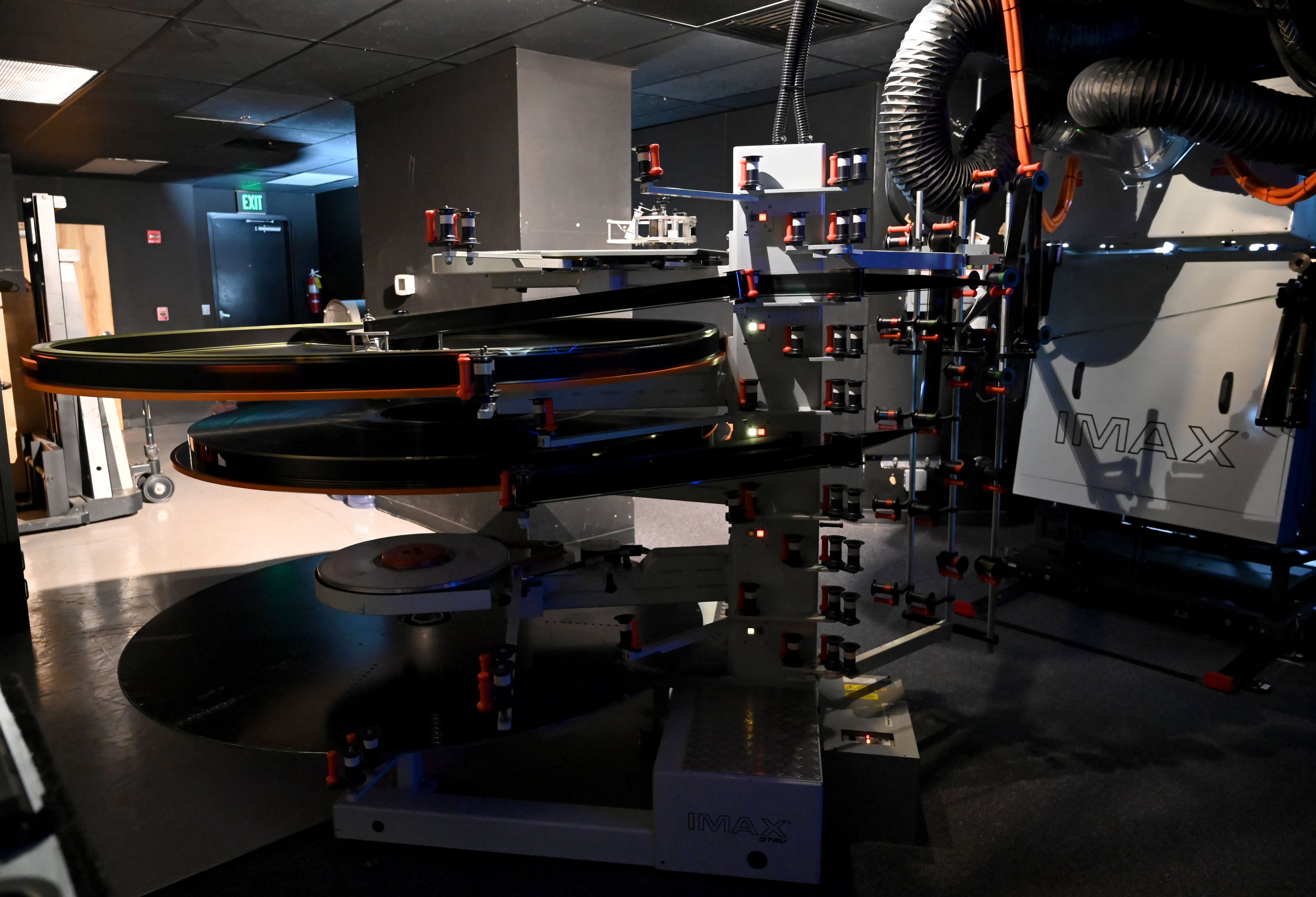 An IMAX 70mm film projector shows “The Odyssey” inside the Regal Mall of Georgia on Friday, Aug. 7, 2026. Some IMAX screenings have been booking out weeks in advance. (Hyosub Shin/AJC)