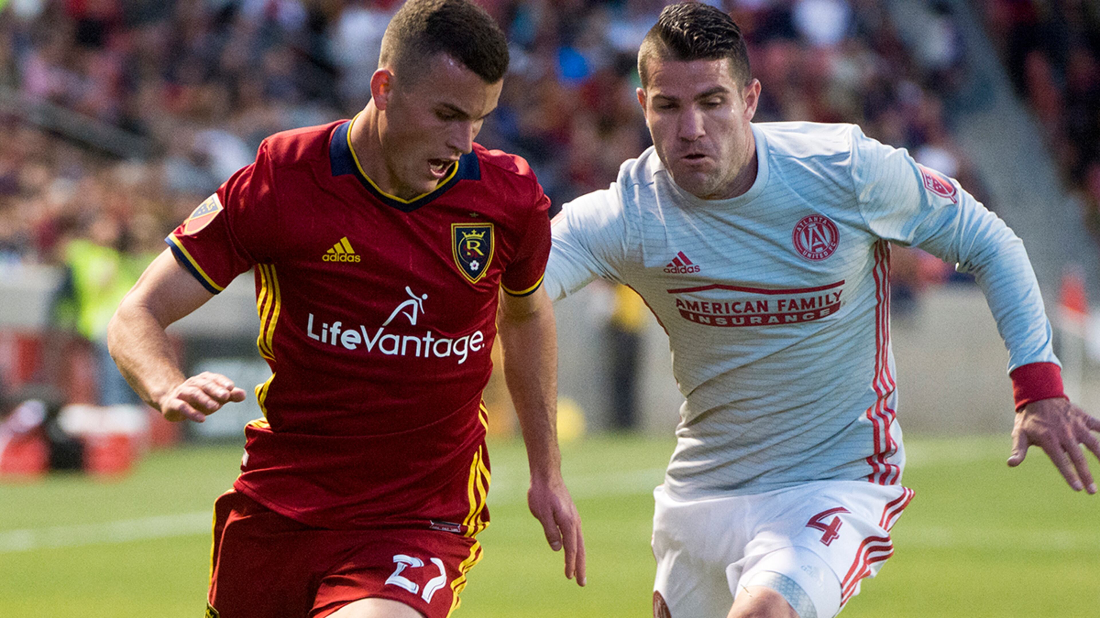Real Salt Lake forward Brooks Lennon (27) goes for the ball along with Atlanta United midfielder Yamil Asad (11) in an MLS soccer match in Salt Lake City on Saturday, April 22, 2017. (Rick Egan/The Salt Lake Tribune via AP)