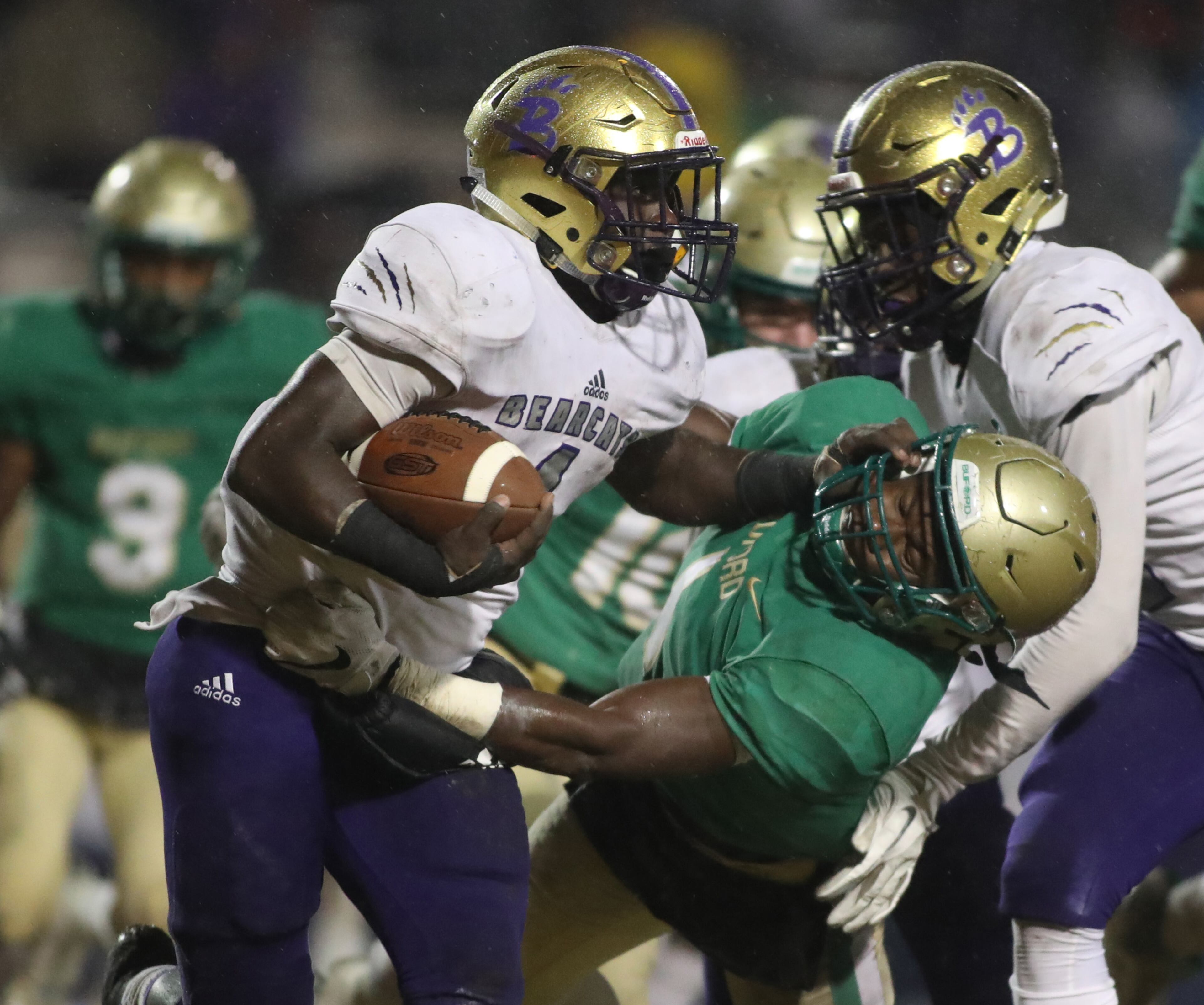 November 23, 2018 - Buford, Ga: Bainbridge running back Rashad Broadax (4) stiff arms Buford defensive back Jamaal Singleton (1) on a run in the second half at Buford High School Friday, November 23, 2018, in Buford, Ga. Buford lost to Bainbridge 23-20. This is the quarter finals of the Class 5A state playoffs. (JASON GETZ/SPECIAL TO THE AJC)