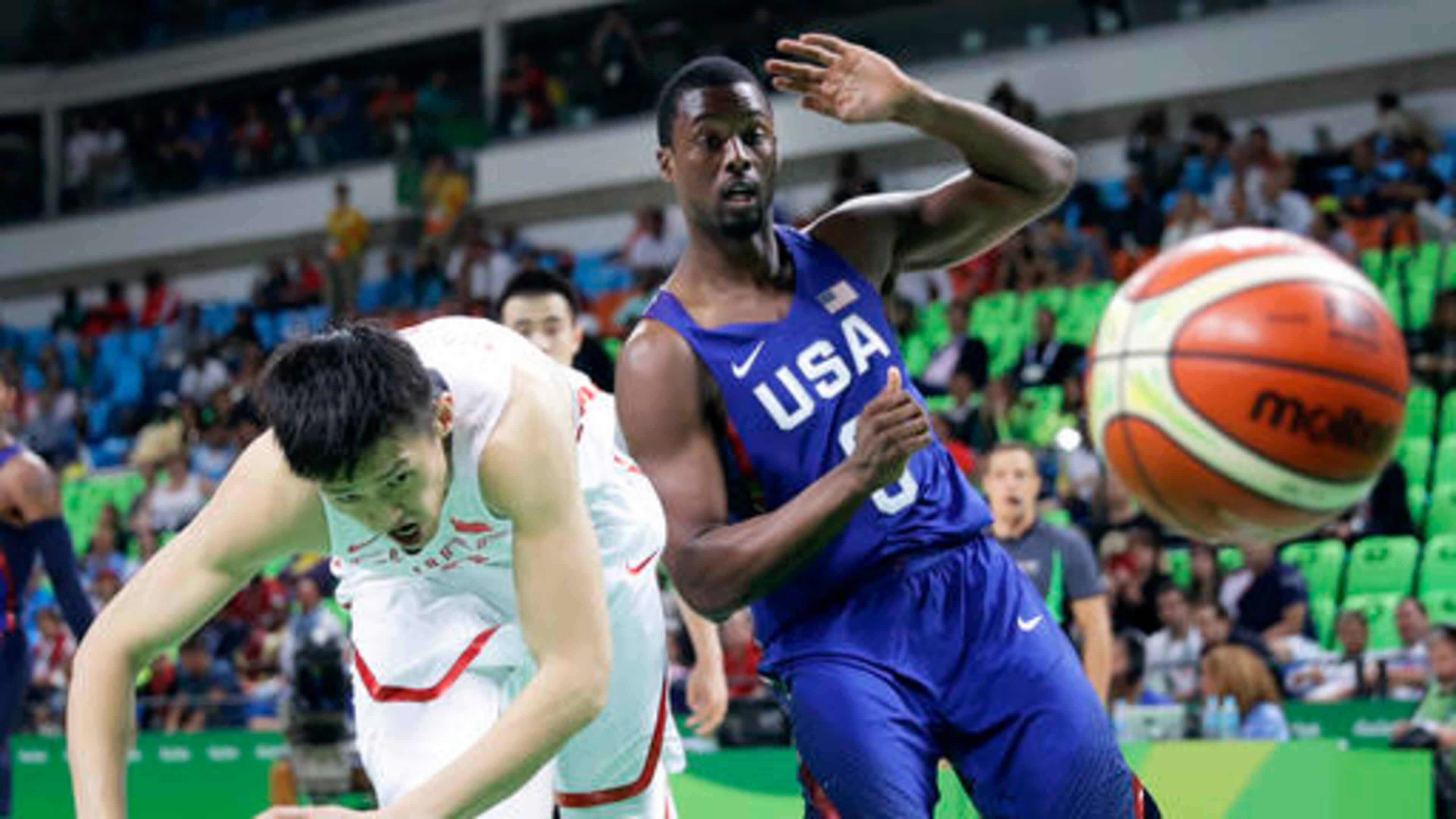 China's Zou Peng, left, fights for a rebound with United States' Harrison Barnes, right, during a basketball game at the 2016 Summer Olympics in Rio de Janeiro, Brazil, Saturday, Aug. 6, 2016. (AP Photo/Charlie Neibergall)