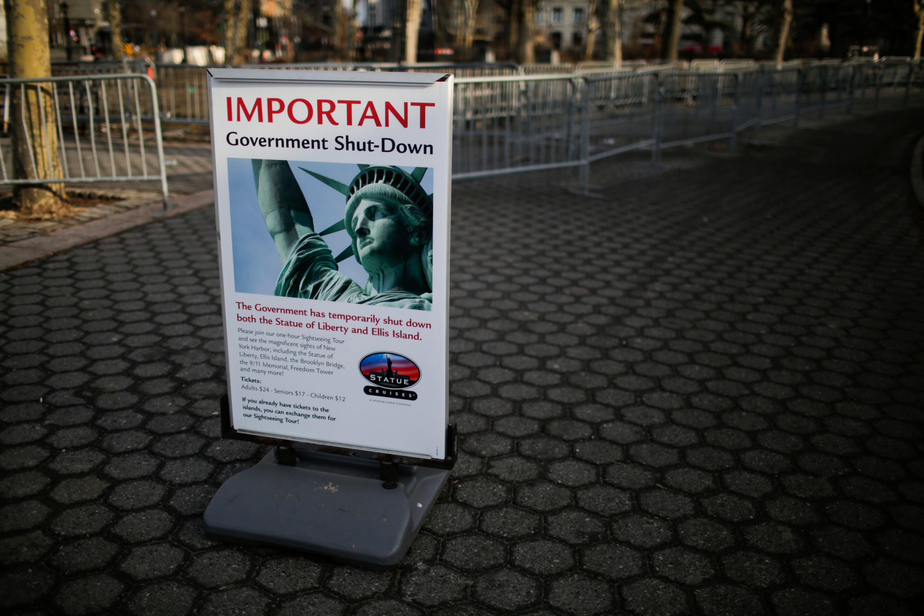 A shutdown placard is seen at the entrance of the Liberty State ferry terminal in Battery Park in New York.