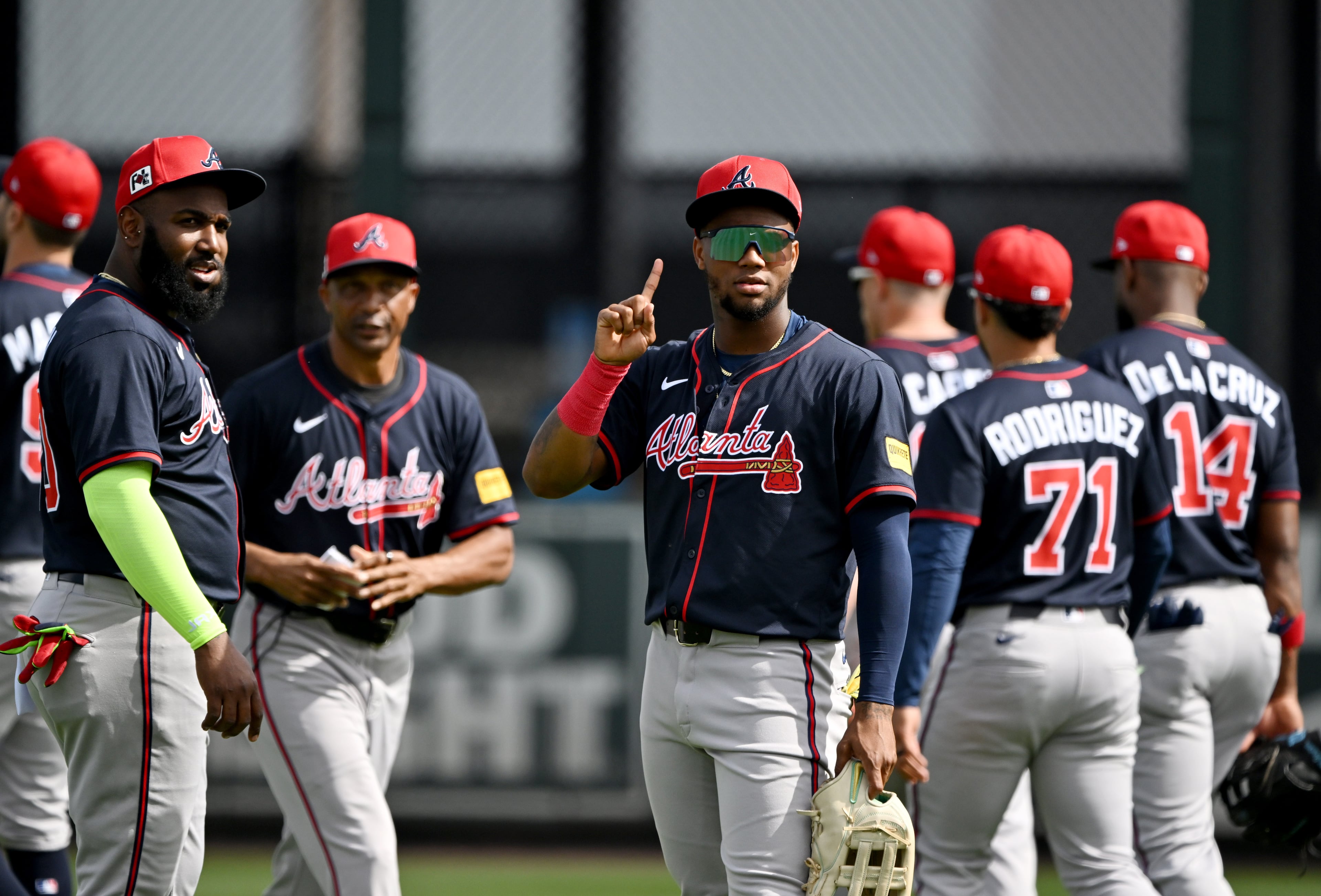 Atlanta Braves outfielder Ronald Acuna Jr. reacts as he warms up with teammates during the first full-squad spring training workouts at CoolToday Park, Tuesday, February 18, 2025, North Port, Florida. (Hyosub Shin / AJC)