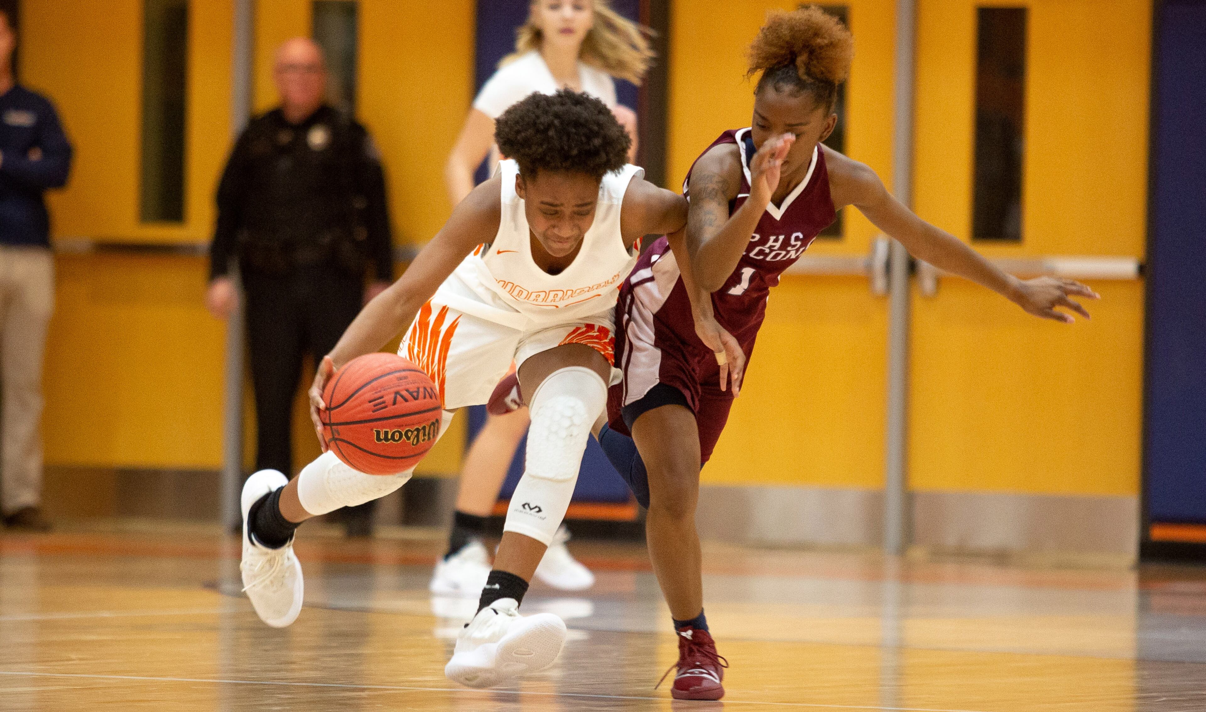 North Cobb High School girls basketball player Dayuna Colin drives past Pebblebrook High School player Jalicia Bass during the first round of the girls' high school basketball tournament at North Cobb High School in Kennesaw February 15, 2018. STEVE SCHAEFER / SPECIAL TO THE AJC