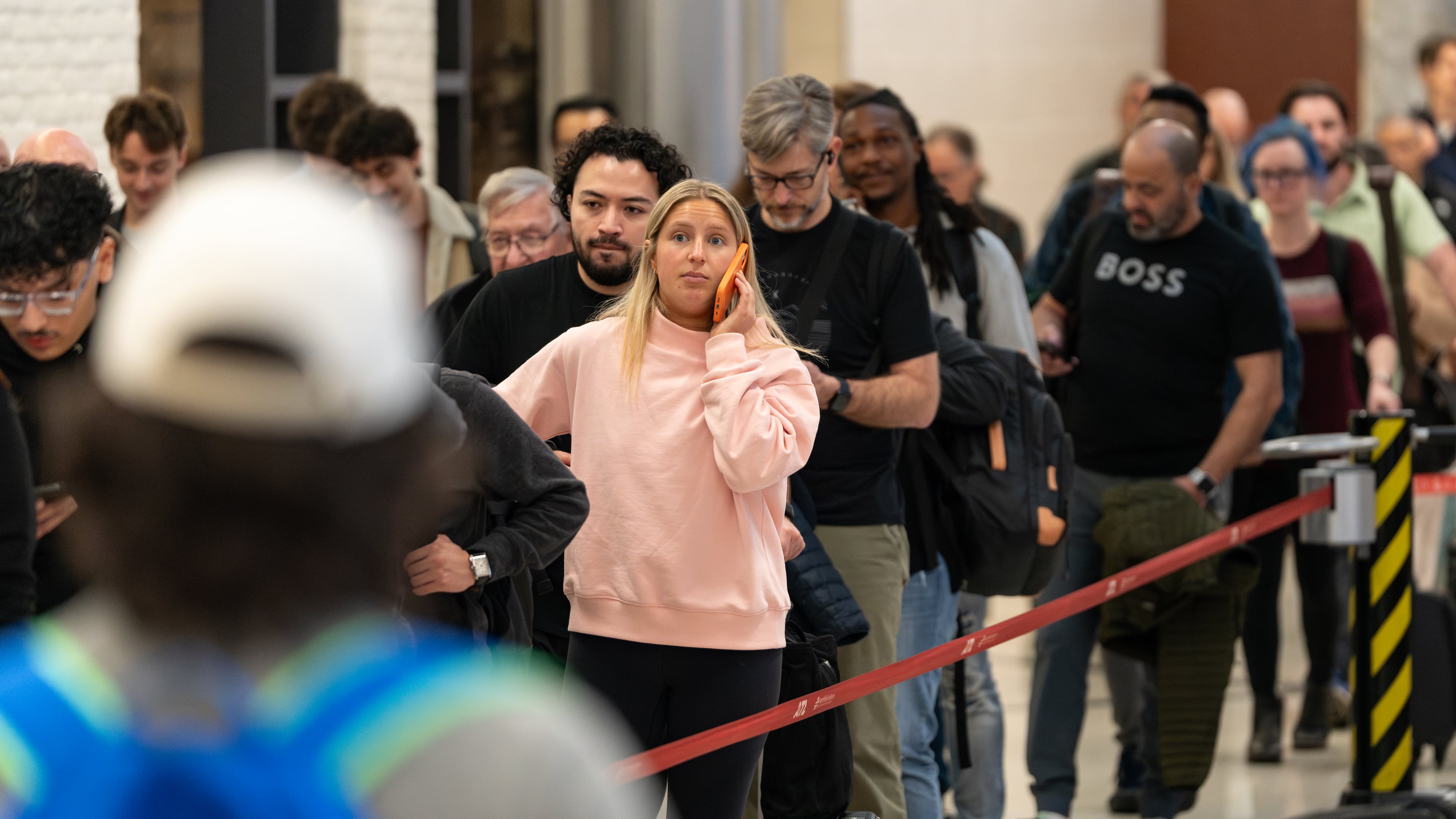 Travelers wait in multihour lines Friday for domestic security at Hartsfield-Jackson Atlanta International Airport amid the ongoing partial government shutdown. (Ben Hendren for the AJC)