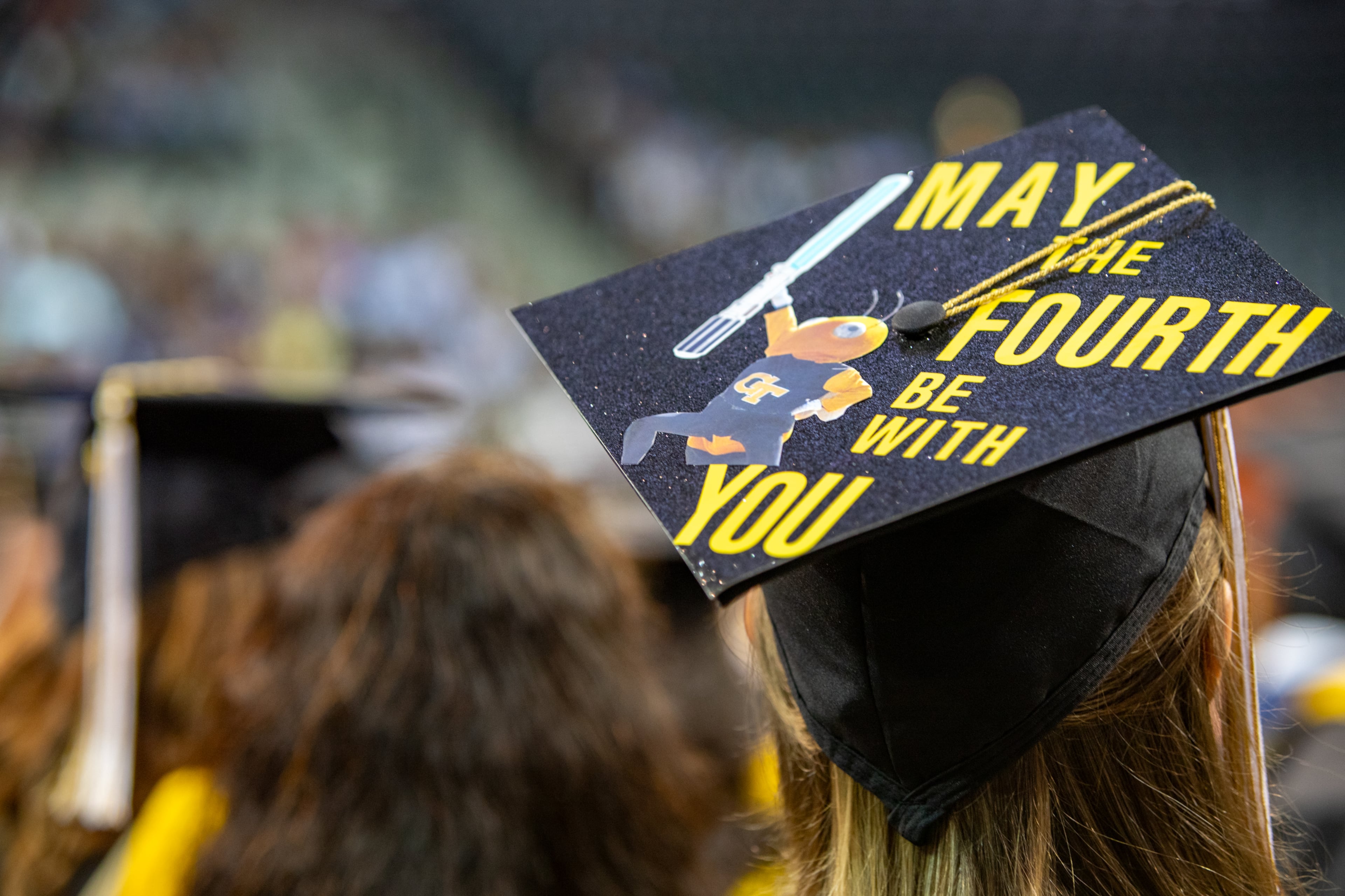 Georgia Tech holds graduation at McCamish Pavilion for students receiving Master's degrees in the College of Computing and Bachelor's degrees in Mechanical Engineers on Saturday, May 4, 2024. Several Star Wars jokes peppered the presentation given the date of the celebration. (Jenni Girtman for The Atlanta Journal-Constitution)
