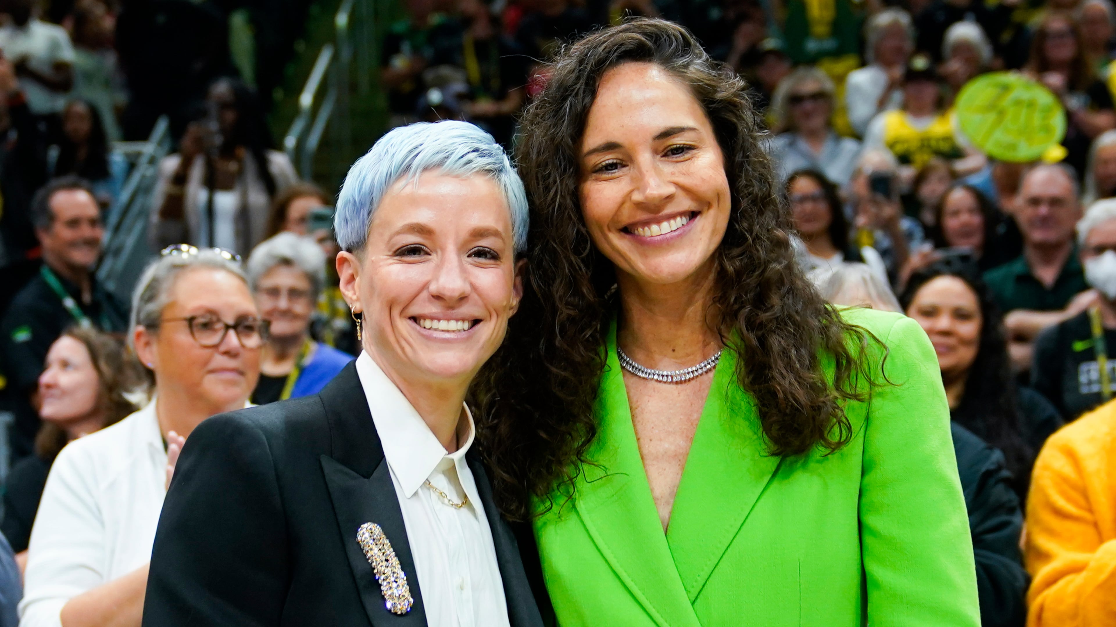 FILE - Megan Rapinoe, left, and Sue Bird pose for photographs before a WNBA basketball game between the Storm and the Washington Mystics, Sunday, June 11, 2023, in Seattle. (AP Photo/Lindsey Wasson, File)
