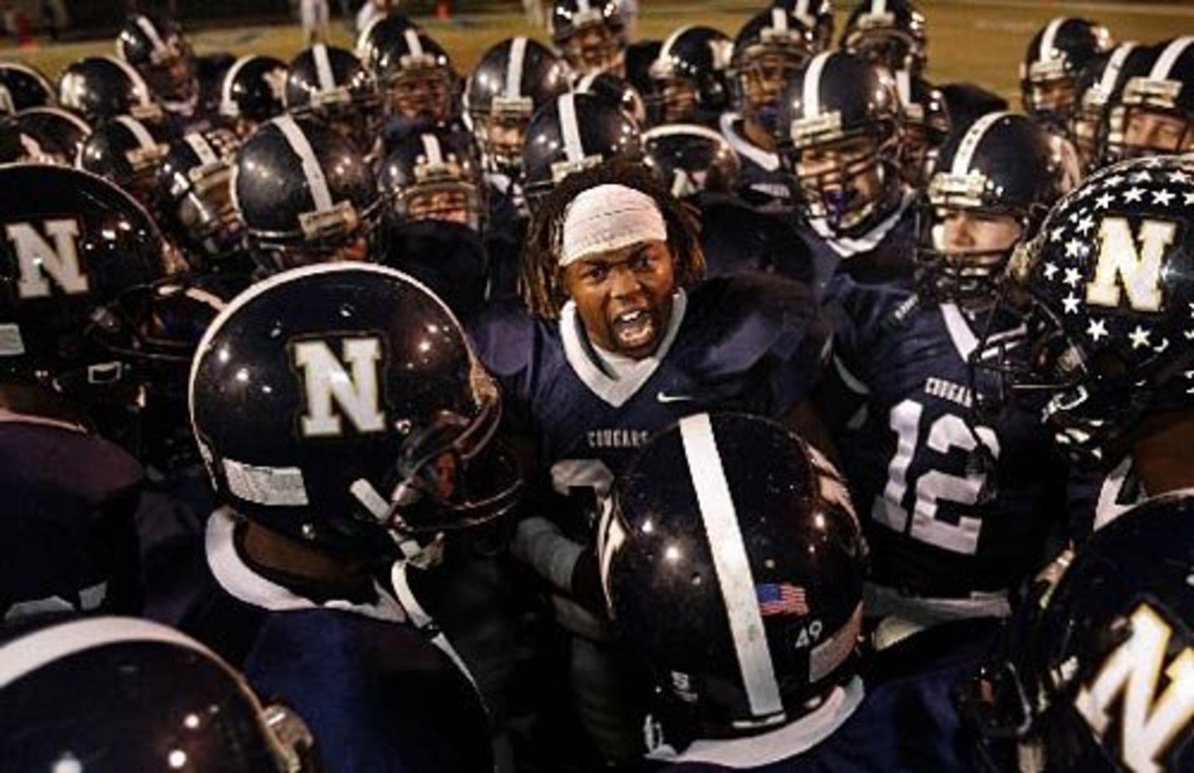 Newnan's Alexander Ogletree (33) gets the team psyched up before their game hosting Northside-Warner Robins in the Class AAAAA semifinal game in Newnan, December 4, 2009.