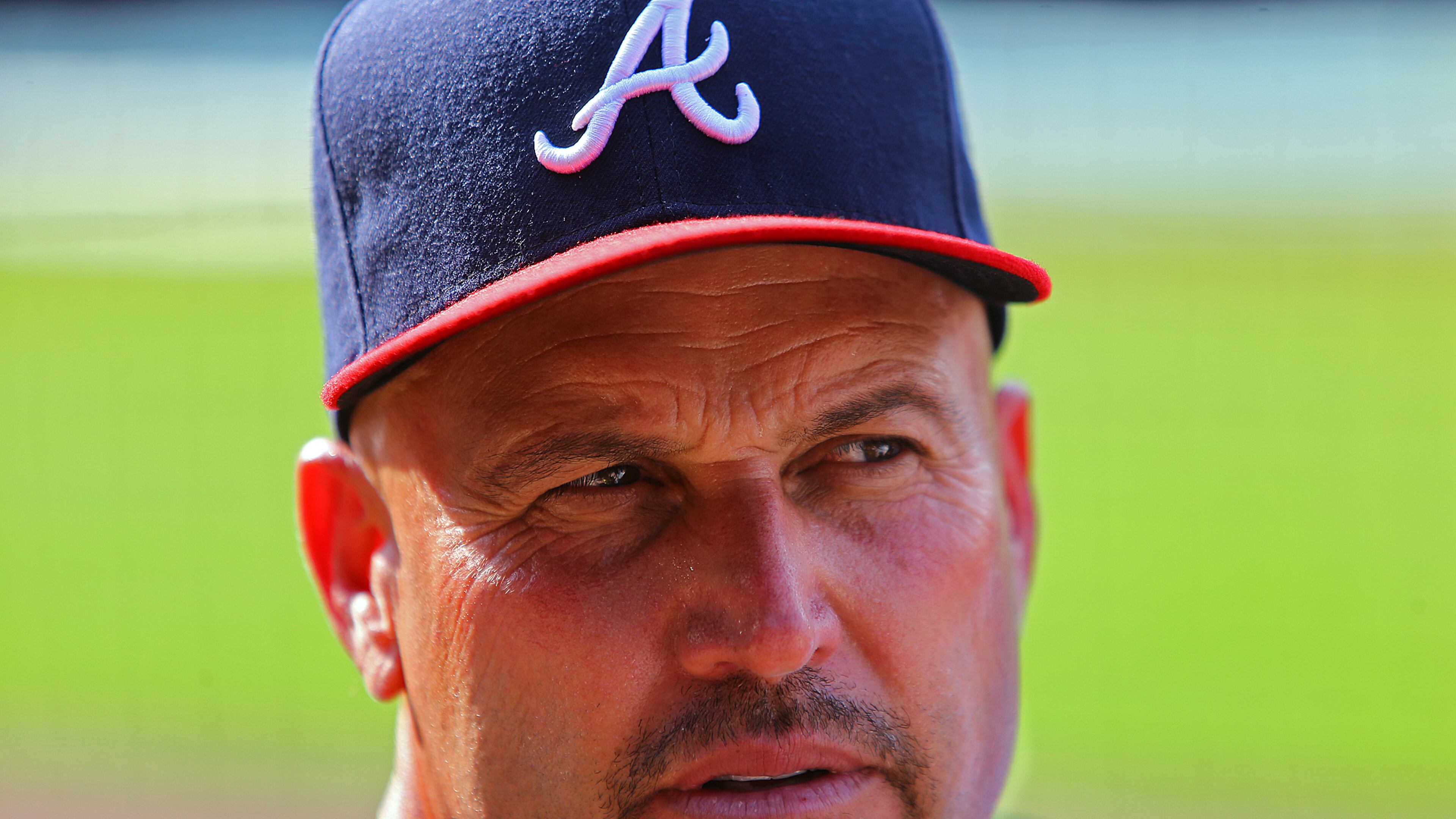 Braves manager Fredi Gonzalez looks over the field from the dug out before playing the Nationals in game three of a three game set in a MLB game on Sunday, August 10, 2014, in Atlanta.