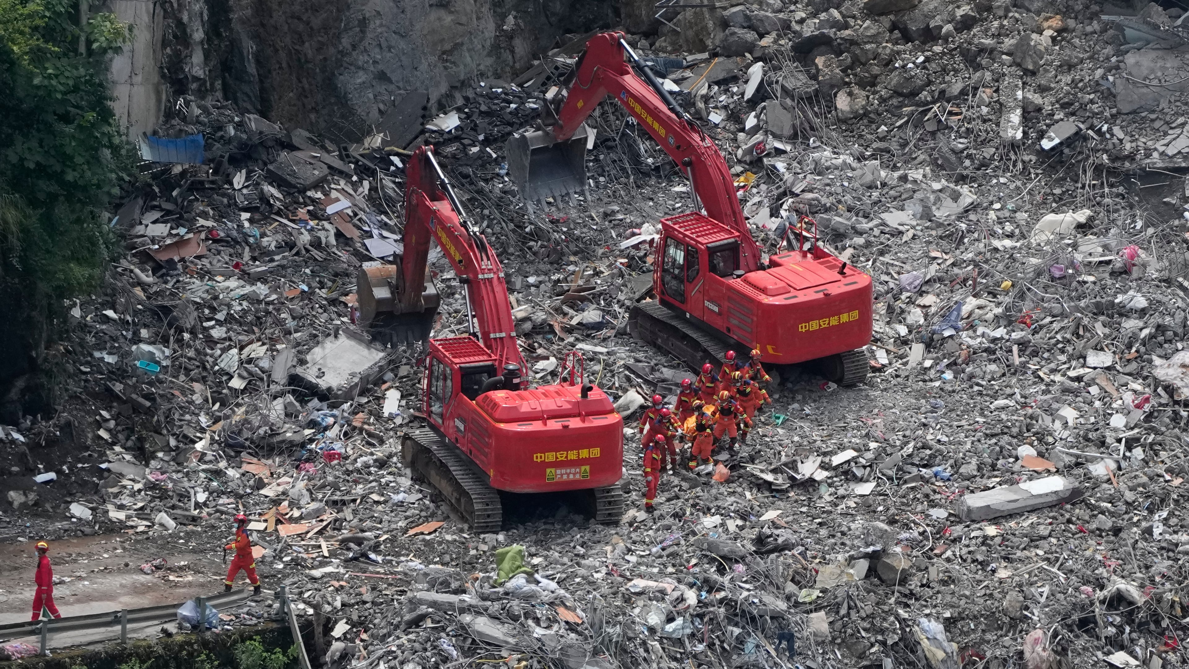 Rescuers work at the site of a landslide in Pengshui County in southwestern China's Chongqing on Sunday, July 19, 2026. (AP Photo/Andy Wong)
