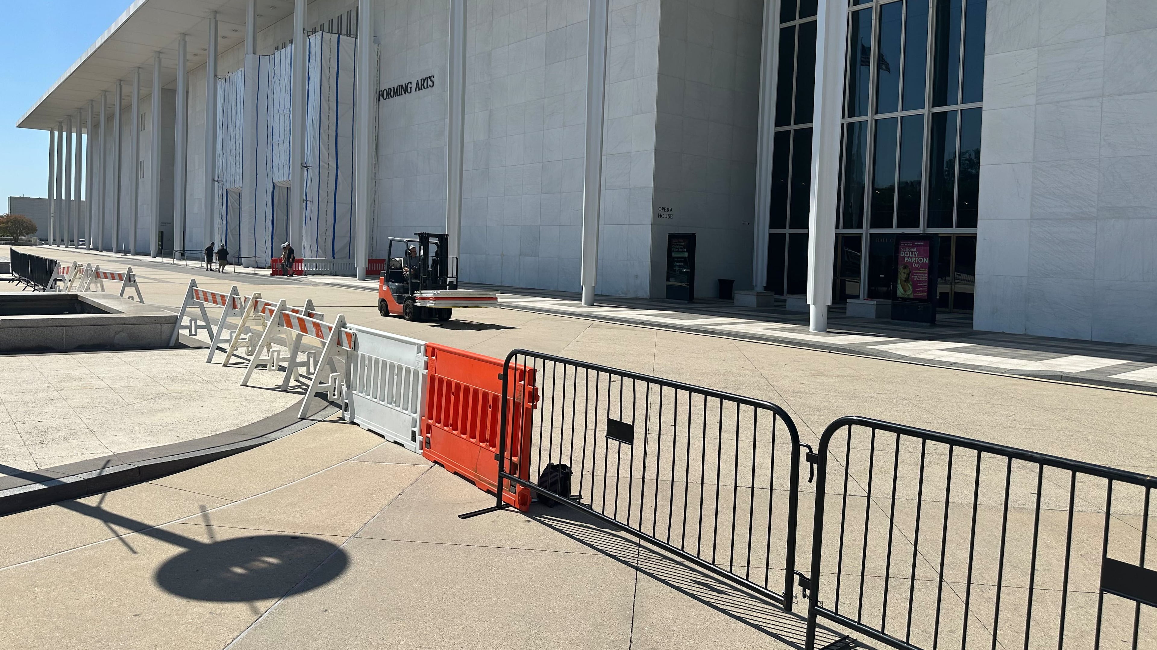 Barriers are placed outside the John F. Kennedy Center for the Performing Arts on Wednesday, Sept. 16, 2026, in Washington. (AP Photo/Nathan Ellgren)