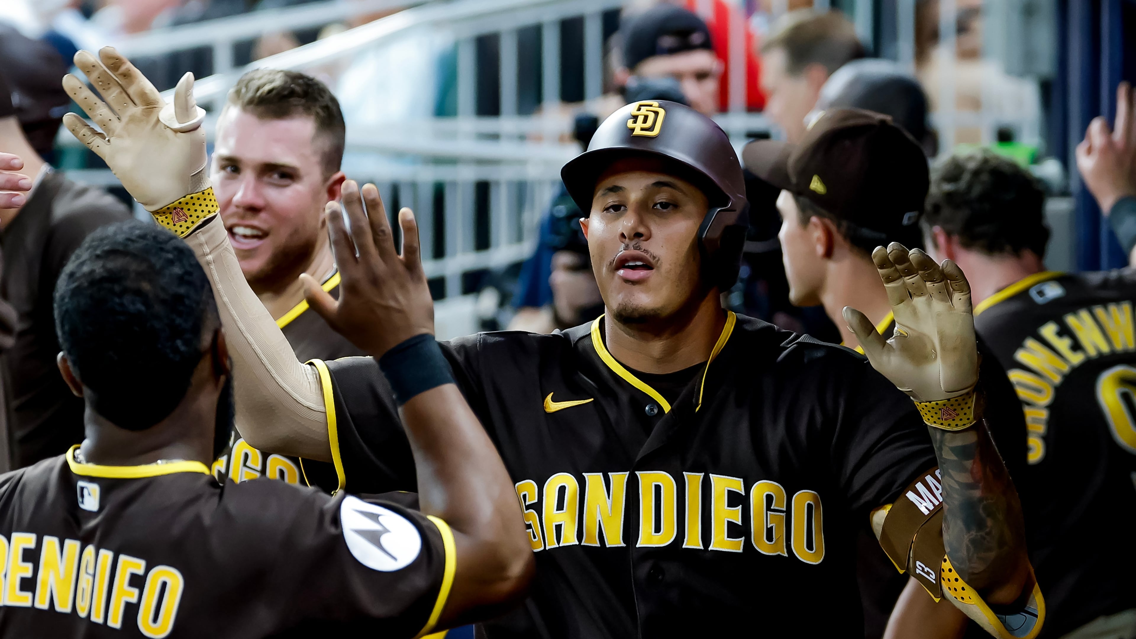 San Diego Padres' Manny Machado is greeted in the dugout after hitting a solo home run against the Atlanta Braves during the sixth inning of a baseball game, Tuesday, July 21, 2026, in Atlanta. (AP Photo/Erik S. Lesser)