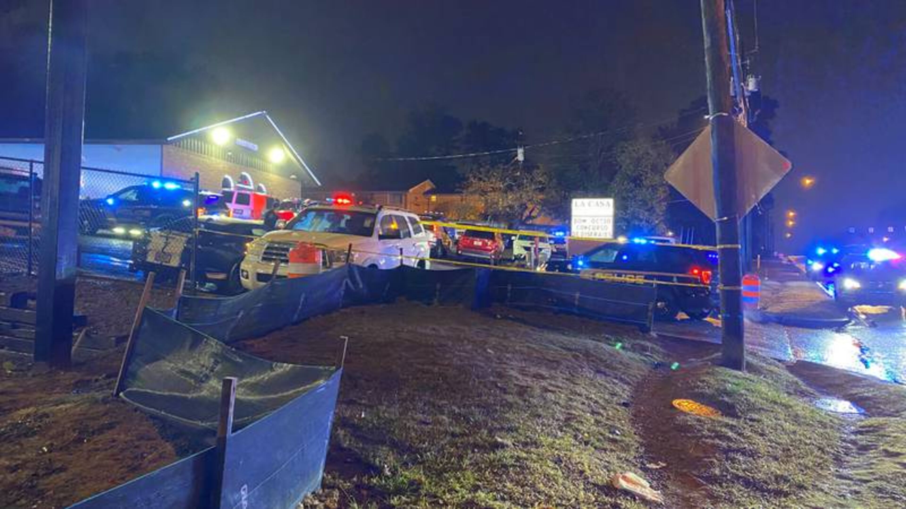 Brookhaven police roped off the parking lot of the La Casa sports bar with crime scene tape after two people were shot early Monday.