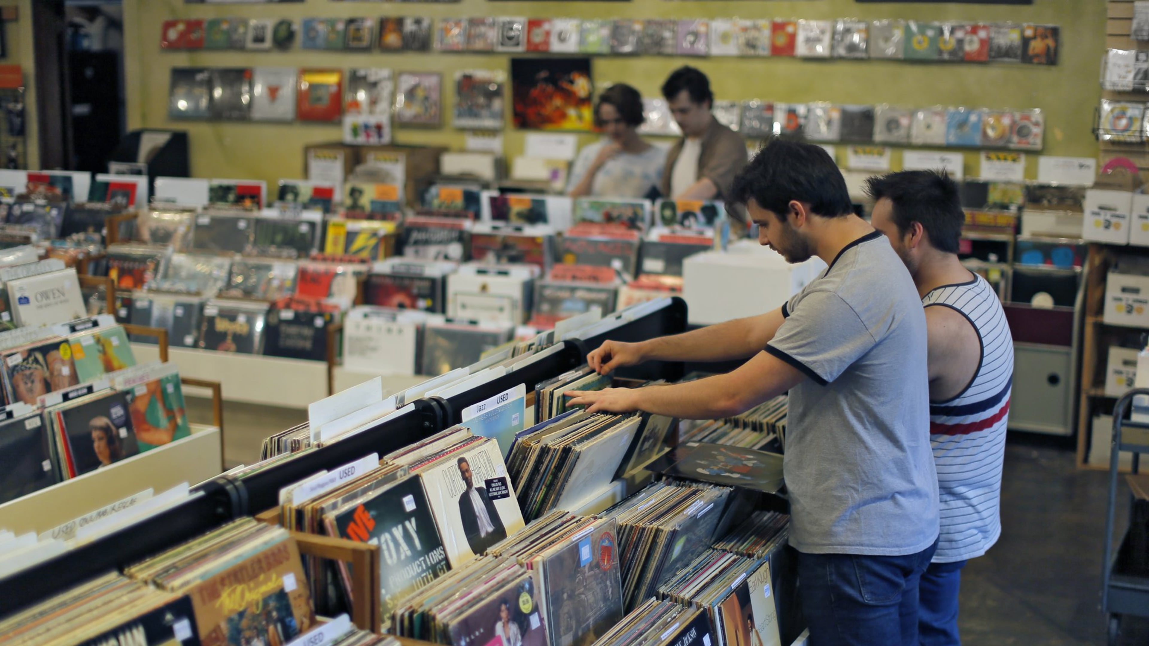 Patrons browse the LPs at Criminal Records. The local independent record store, located in Little Five Points, is one of more than 20 metro Atlanta businesses that will participate in the 10th annual Record Store Day on April 22. The event includes exclusive Record Store Day releases, raffles, live music and giveaways. BOB ANDRES / BANDRES@AJC.COM