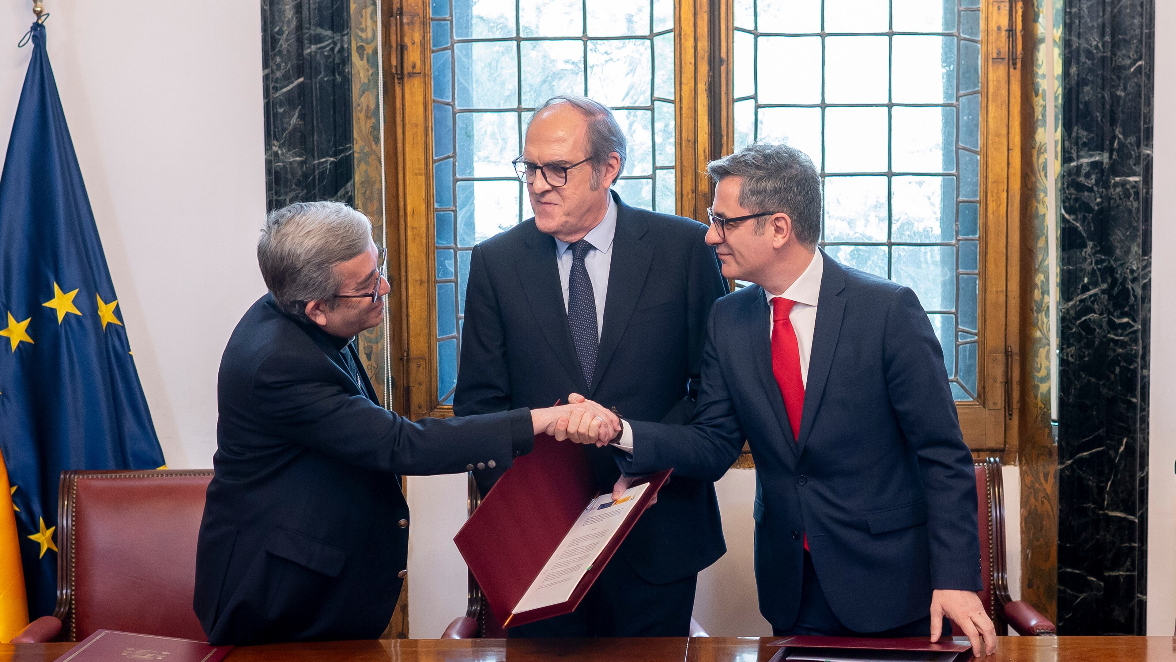 From left, Luis Arguello, the president of the Spanish Episcopal Conference, Angel Gabilondo, the Ombudsman and Felix Bolanos the Minister of the Presidency, Justice and Relations with Parliament after the signing of an agreement to provide redress to victims of time-barred abuse in Madrid, Spain, Monday, March 30, 2026. (Alberto Ortega/Europa Press via AP)