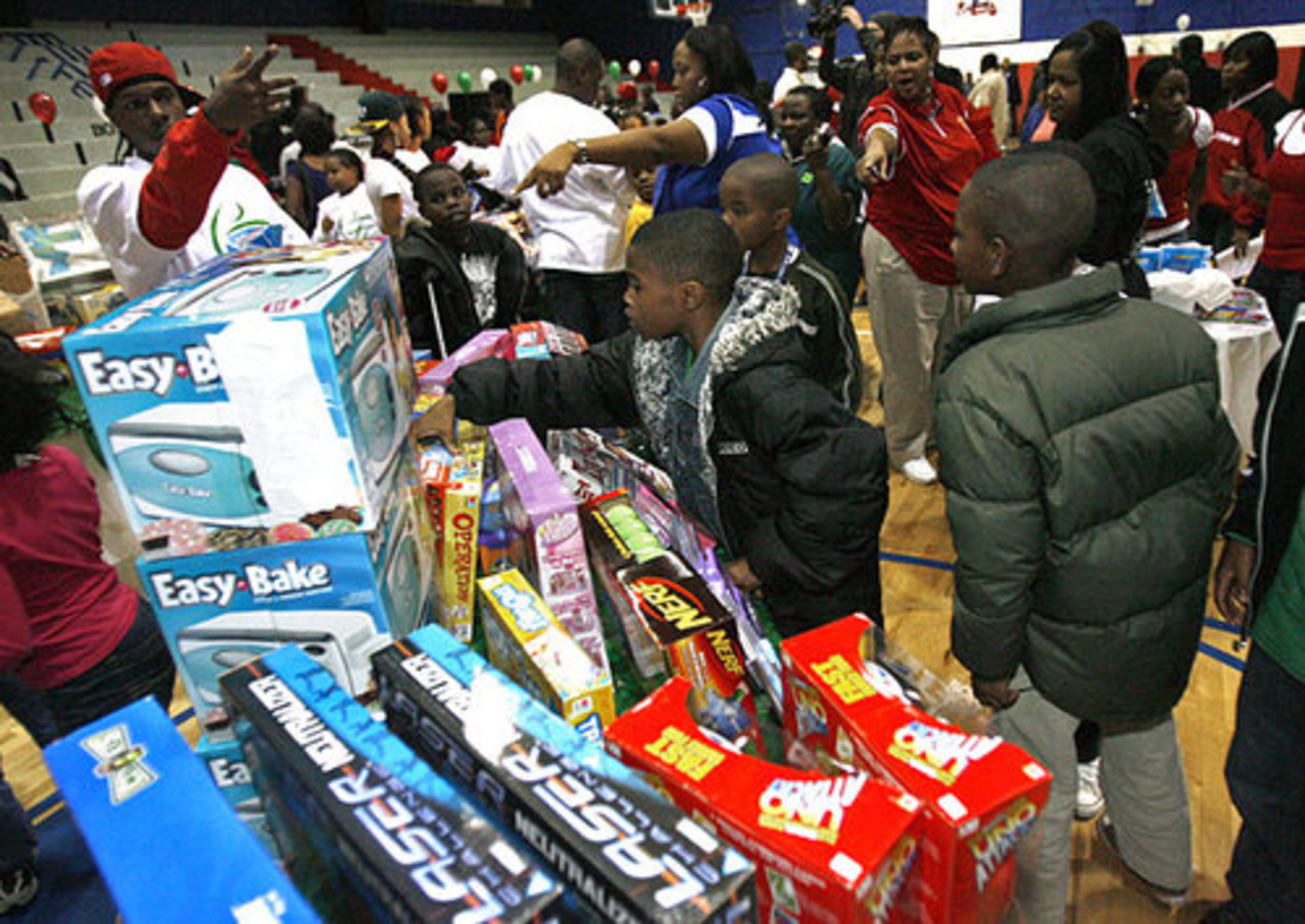 More than 200 children picked from among an array of toys at the event sponsored by the Chris Tucker Foundation.