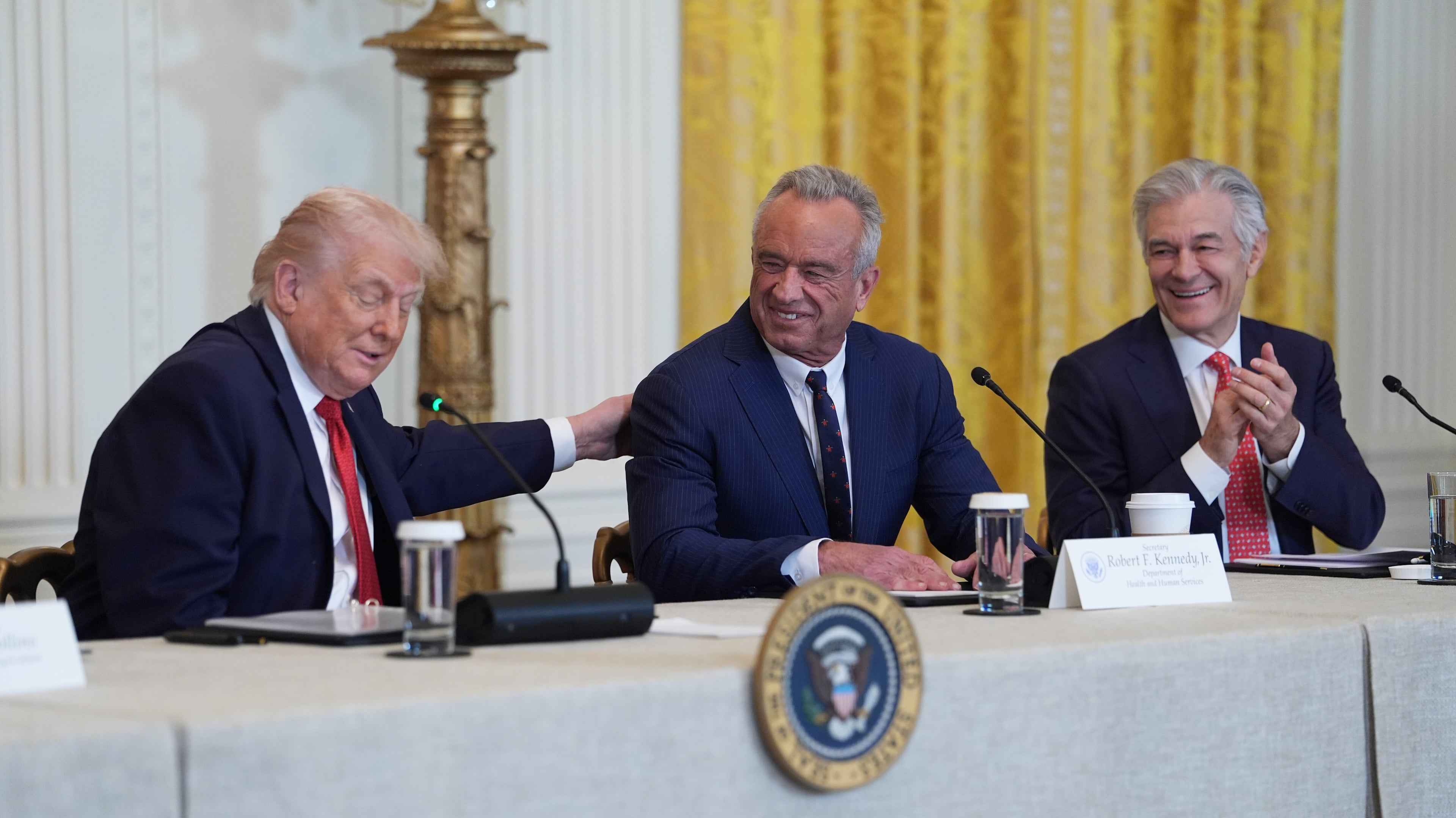 President Donald Trump attends an event to promote investment in rural health care in the East Room of the White House, Friday, Jan. 16, 2026, in Washington. Standing with the President are Secretary of Health and Human Services, Robert F. Kennedy, Jr., and Mehmet Oz, Administrator for the Centers for Medicare & Medicaid Services. (AP Photo/Evan Vucci)
