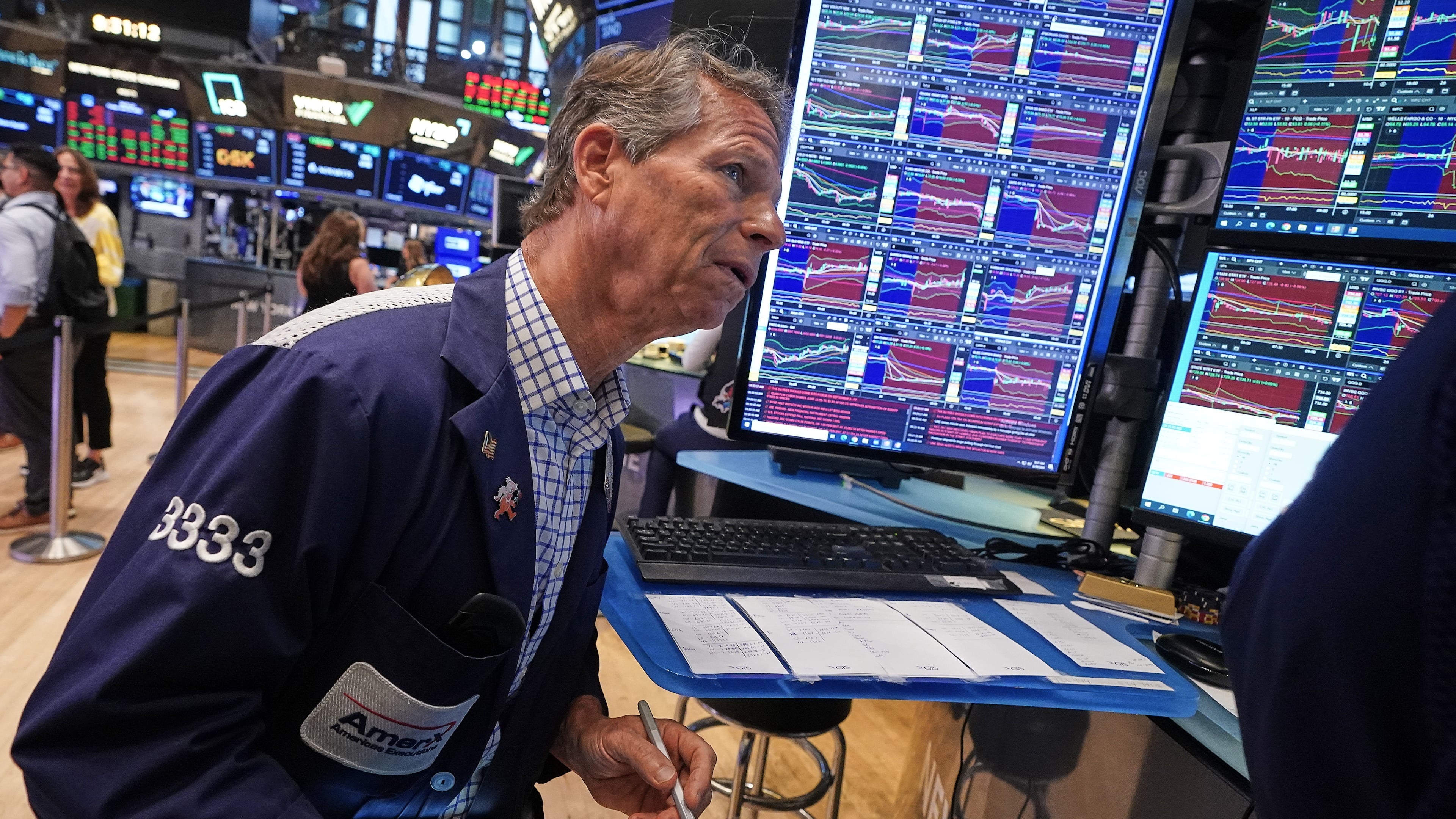 Trader Robert Charmak works on the floor of the New York Stock Exchange, Friday, June 26, 2026. (AP Photo/Richard Drew)