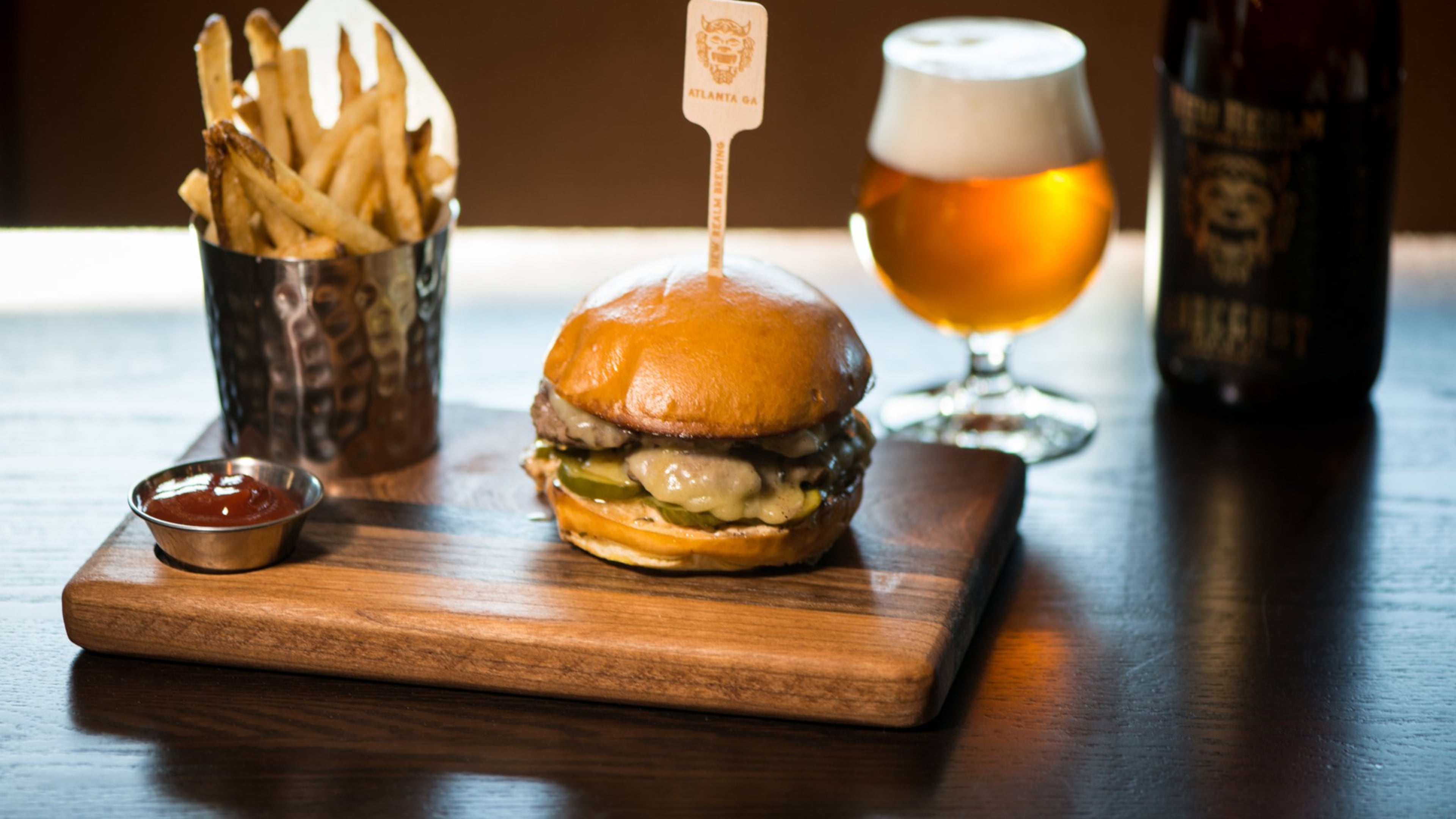 New Realm Brewing The Radegast Burger with White Cheddar, House made Sour Pickles, Special Sauce, Brioche Bun, pictured with Radegast Triple IPA.. Photo credit- Mia Yakel.