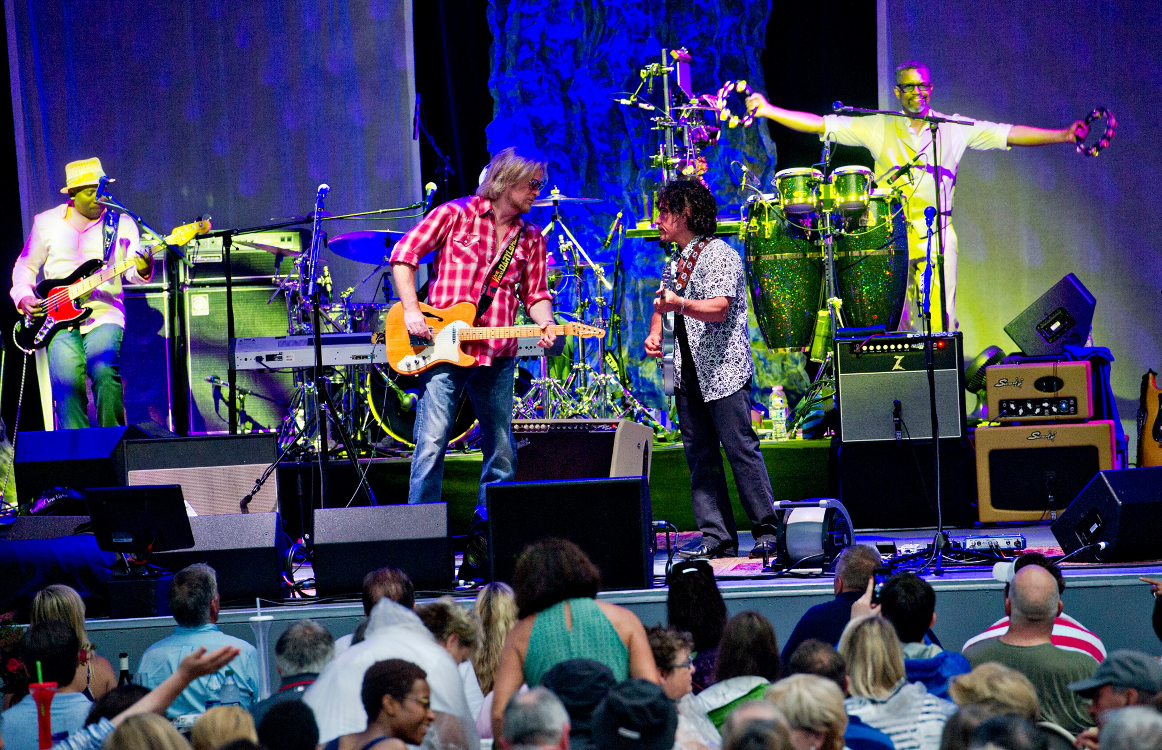 Daryl Hall (left) and John Oates perform Sunday, June 15, 2014 at Chastain Park Amphitheatre in Atlanta. JONATHAN PHILLIPS / SPECIAL