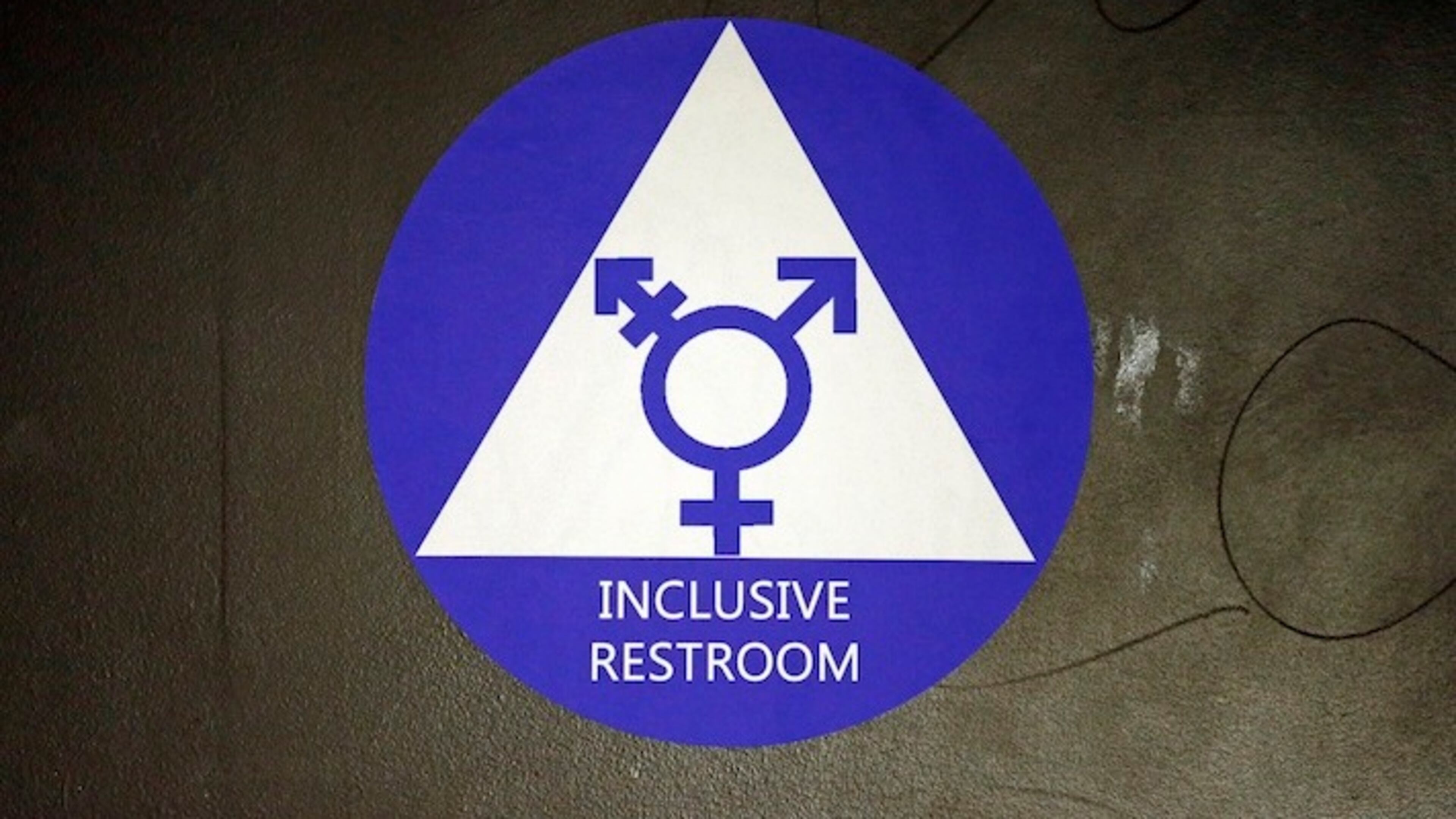 A new sticker designates a gender neutral bathroom at Nathan Hale high school Tuesday, May 17, 2016, in Seattle. President Obama’s directive ordering schools to accommodate transgender students has been controversial in some places but since 2012 Seattle has mandated that transgender students be able to use of the bathrooms and locker rooms of their choice. Nearly half of the district’s 15 high schools already have gender neutral bathrooms and one high school has had a transgender bathroom for 20 years. (AP Photo/Elaine Thompson)