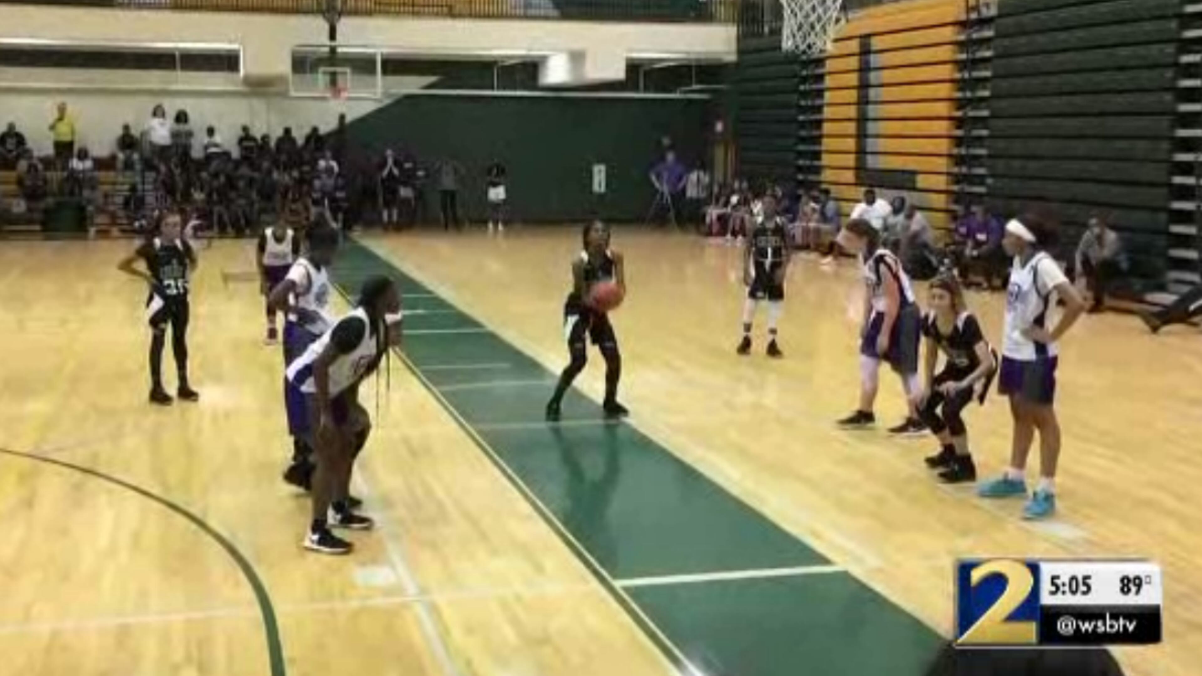 A screenshot of a video that allegedly shows the moments before a brawl broke out at this girls basketball game.