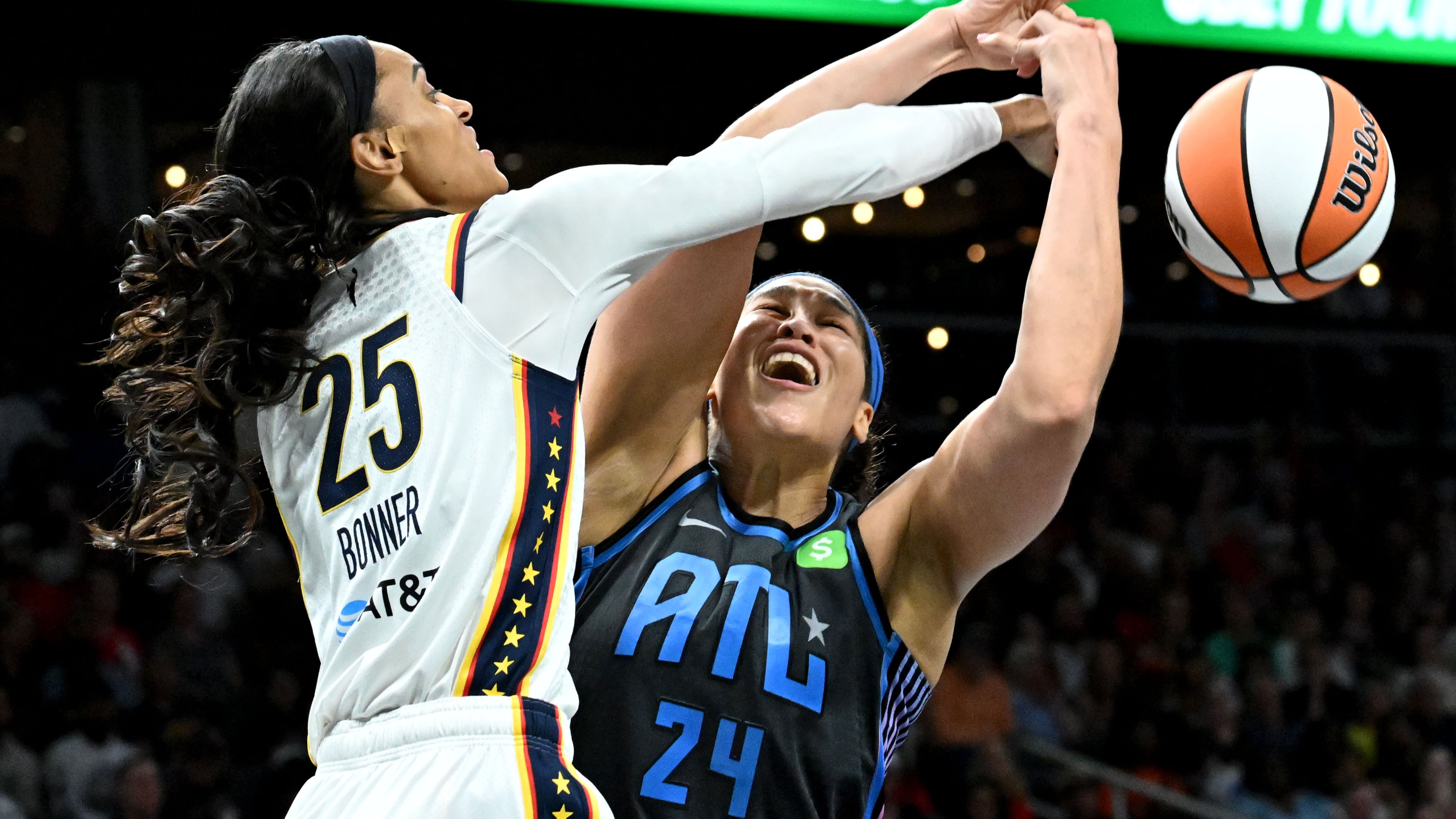 Atlanta Dream forward Brionna Jones fights for a rebound against Indiana Fever forward DeWanna Bonner during the second half in the Dream’s home opener at State Farm Arena, Thursday, May 22, 2025. (Hyosub Shin/AJC)