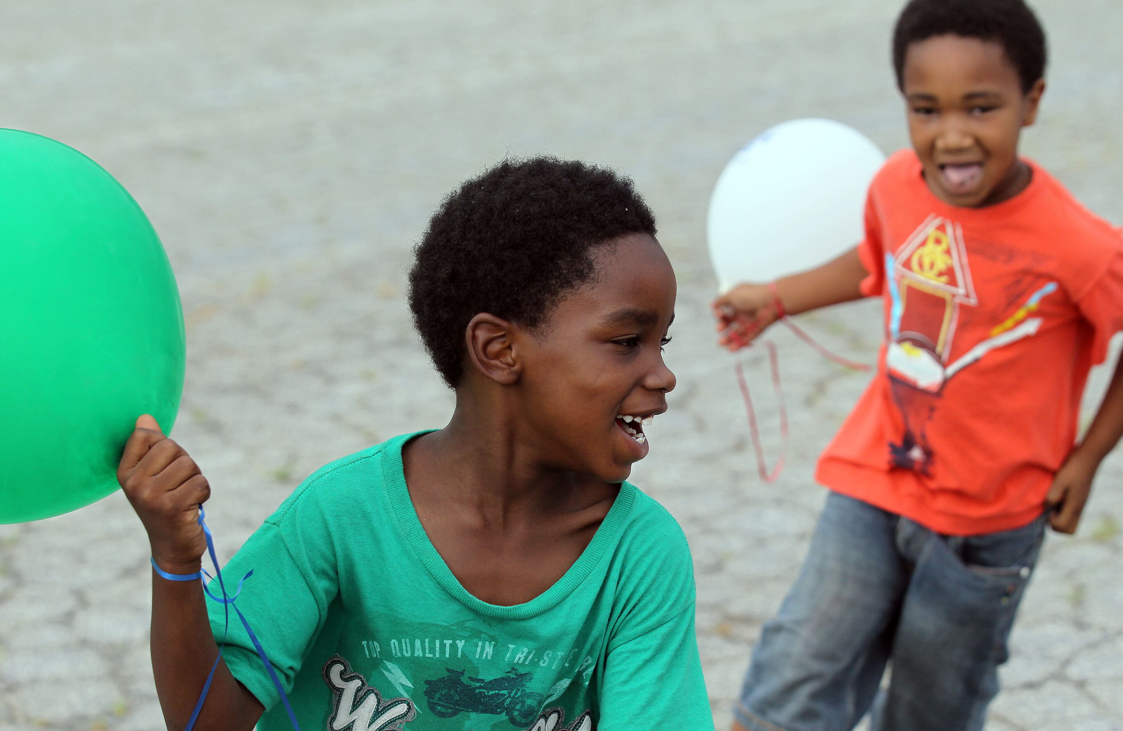 Joshua Browner (left) was chased by his cousin Corey Browner(both age 6) during the 30th anniversary of National Night Out in the Pittsburg area of Atlanta on Tuesday.