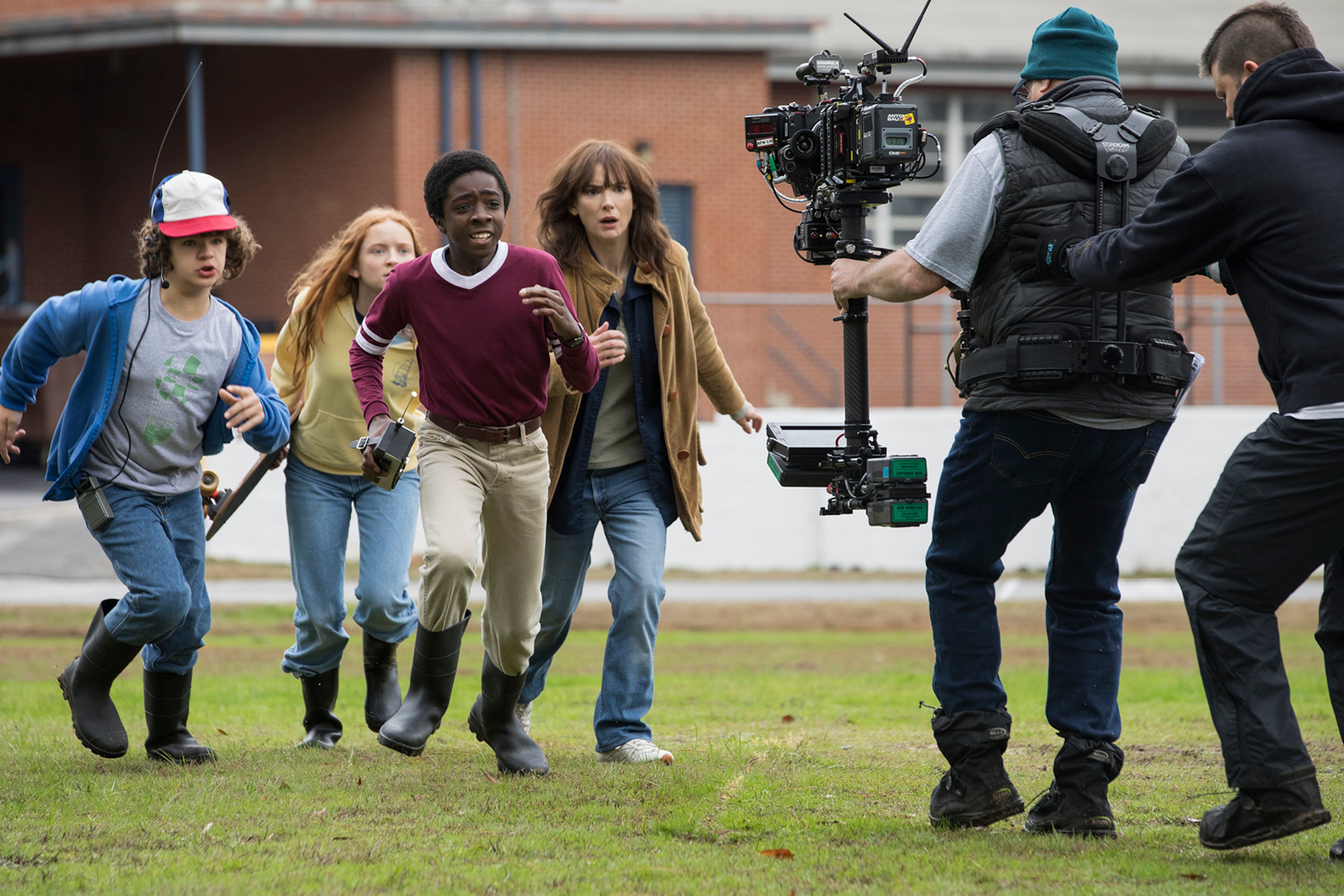 A behind the scenes shot of "Stranger Things" from Season 2 featuring (from left) Dustin (Gaten Matarazzo), Max (Sadie Sink), Lucas (Caleb McLaughlin) and Joyce (Winona Ryder). (Courtesy of Netflix)