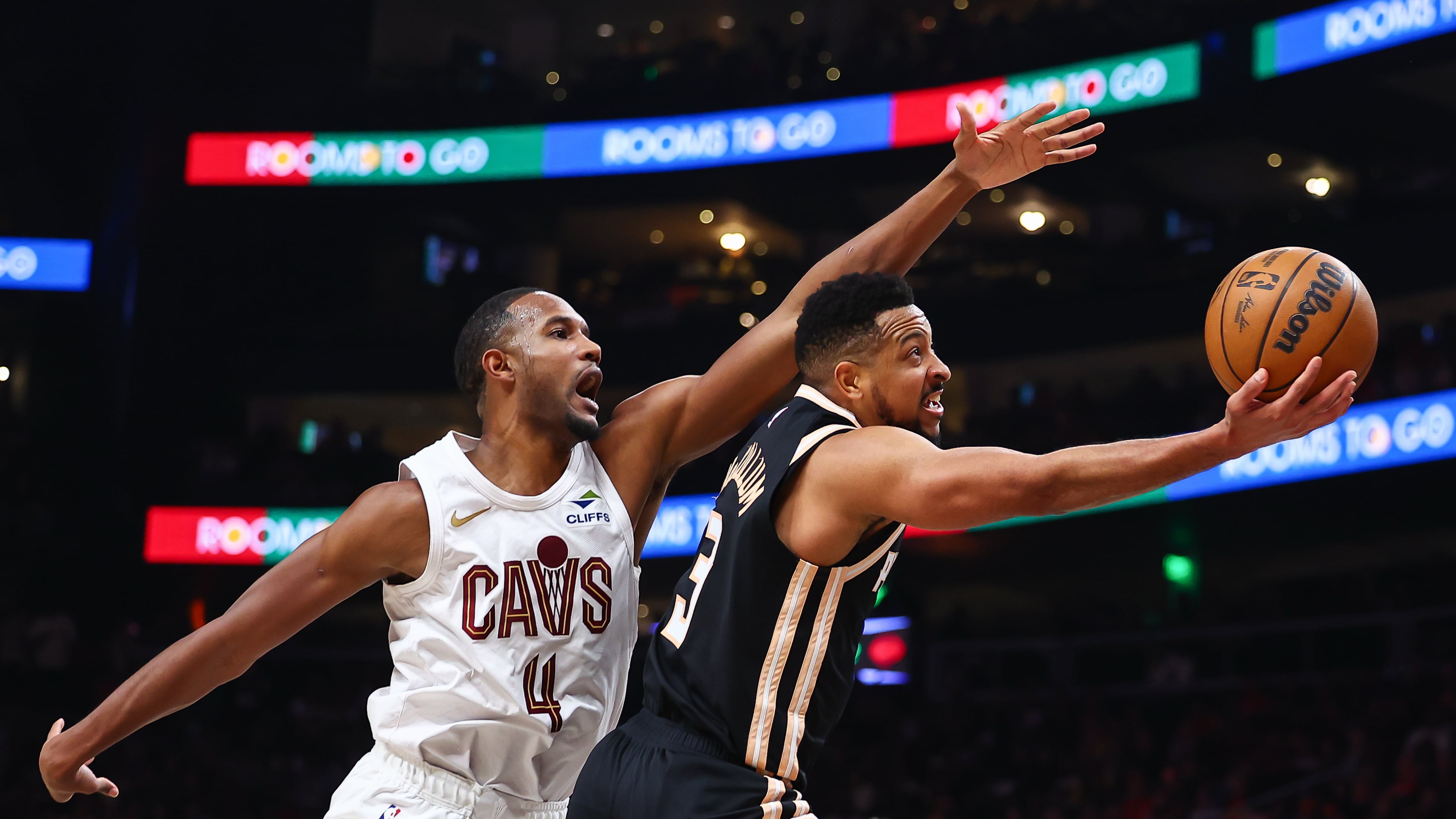 Atlanta Hawks guard CJ McCollum (right) shoots against Cleveland Cavaliers center Evan Mobley during the second half of an NBA basketball game, Friday, April 10, 2026, in Atlanta. (Colin Hubbard/AP)