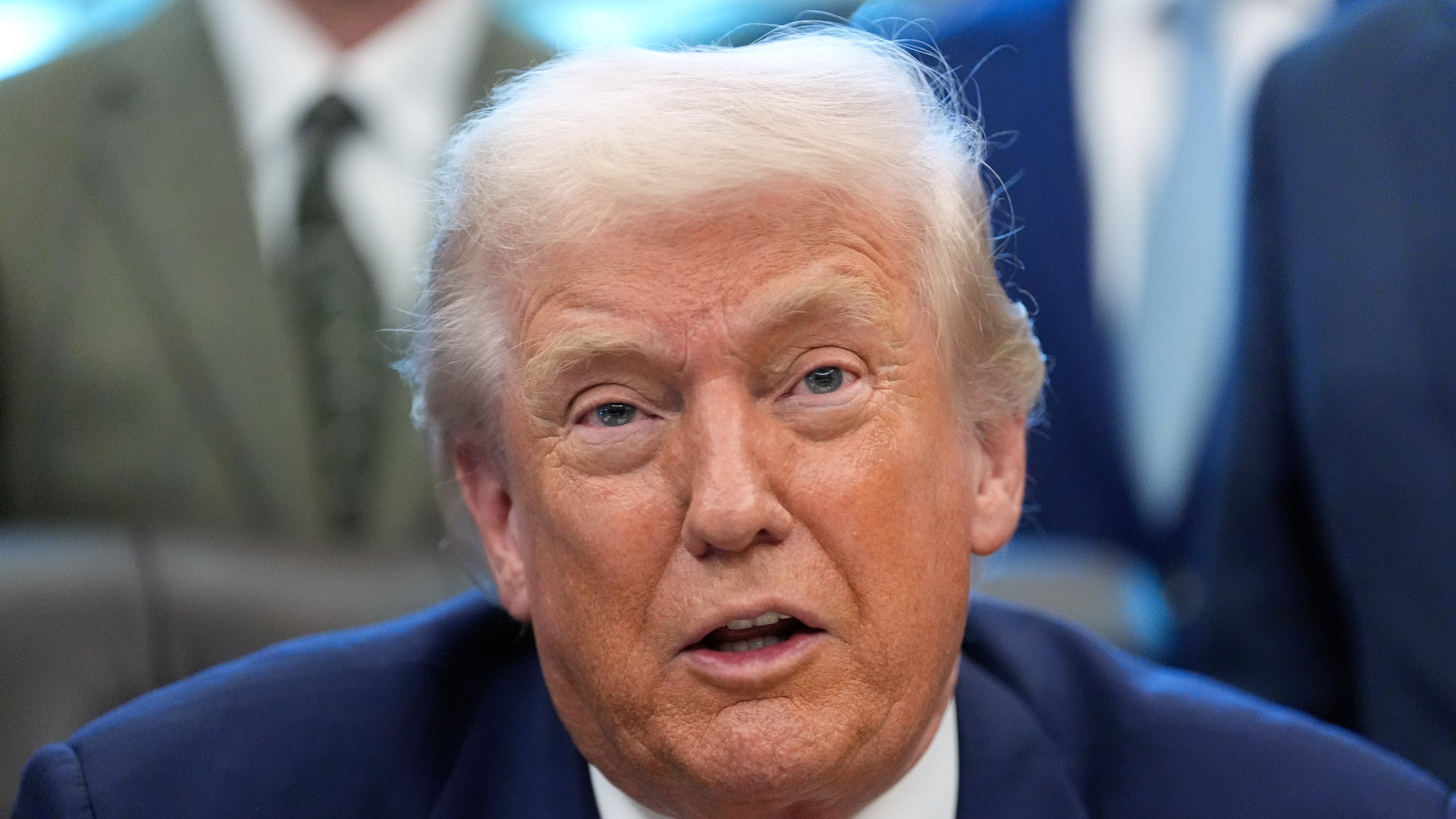 President Donald Trump speaks to reporters after signing a spending bill that ends a partial shutdown of the federal government in the Oval Office of the White House, Tuesday, Feb. 3, 2026, in Washington. (AP Photo/Alex Brandon)