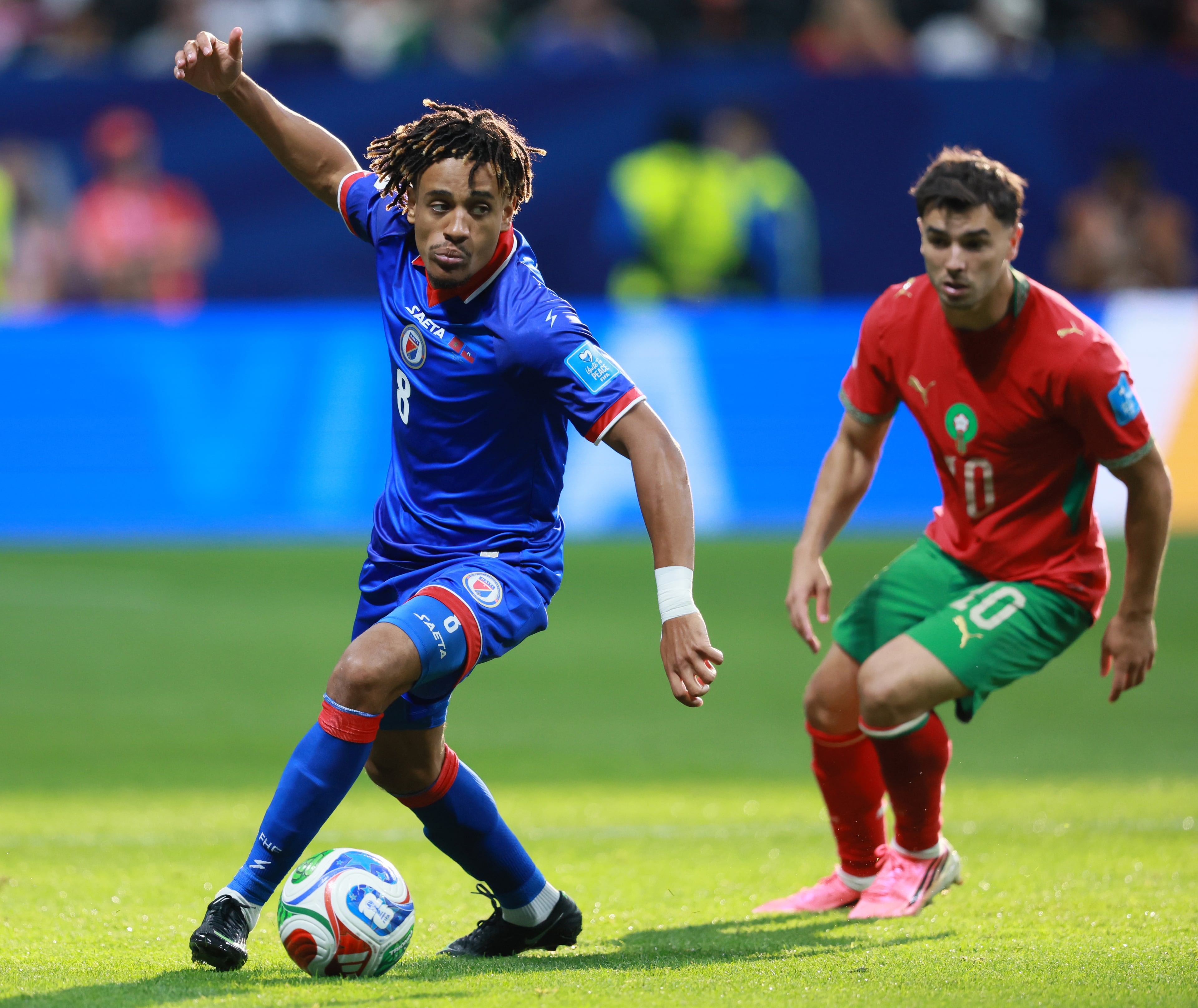 Haiti's Martin Experience, left, controls the ball as Morocco's Brahim Diaz gives chase during second half of Morocco vs. Haiti Group C FIFA World Cup match at Atlanta Stadium (Mercedes-Benz Stadium) on Wednesday, June 24, 2026. (Jason Getz/AJC)