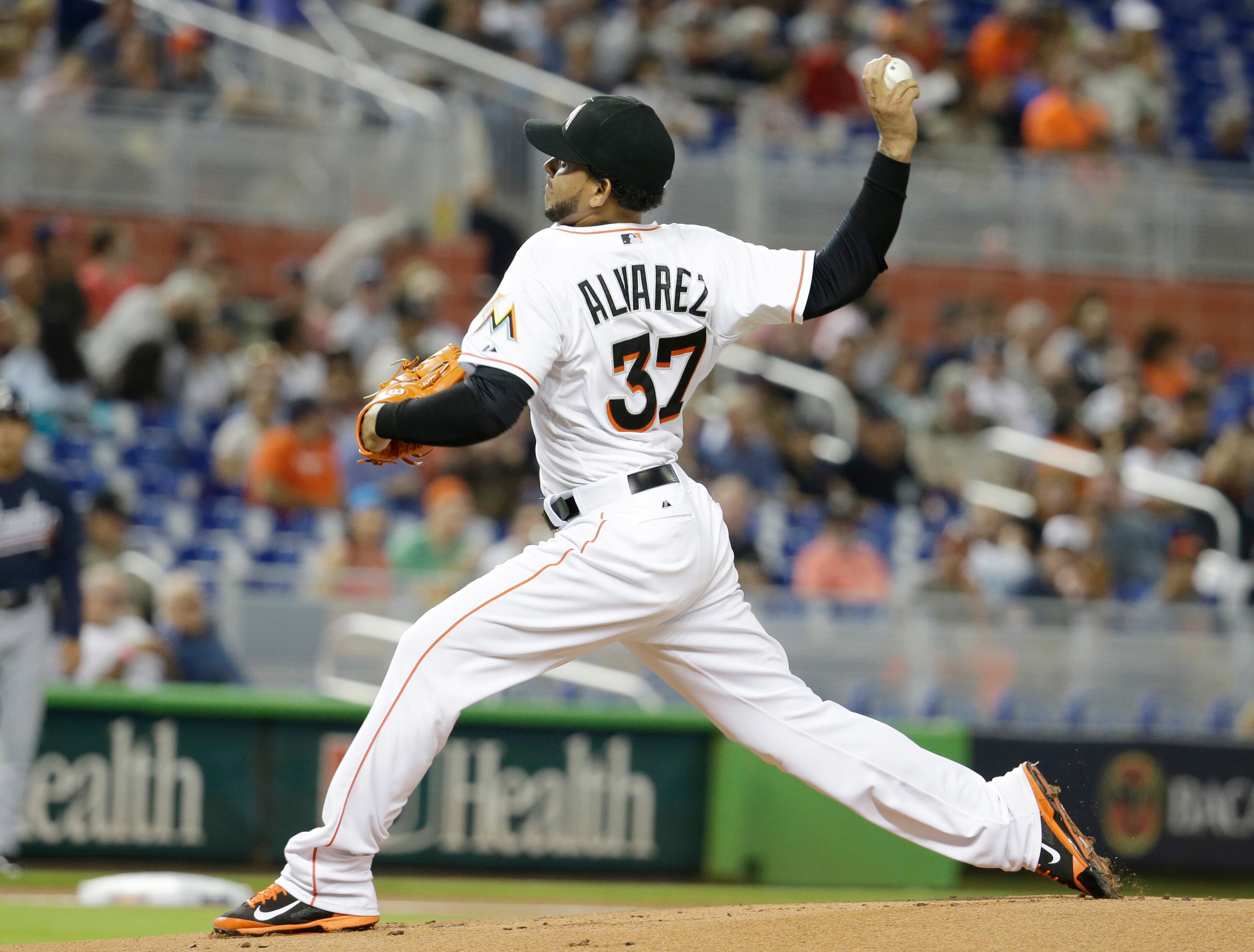 Miami Marlins starting pitcher Henderson Alvarez throws in the first inning of a baseball game against the Atlanta Braves, Thursday, May 1, 2014, in Miami. (AP Photo/Lynne Sladky)