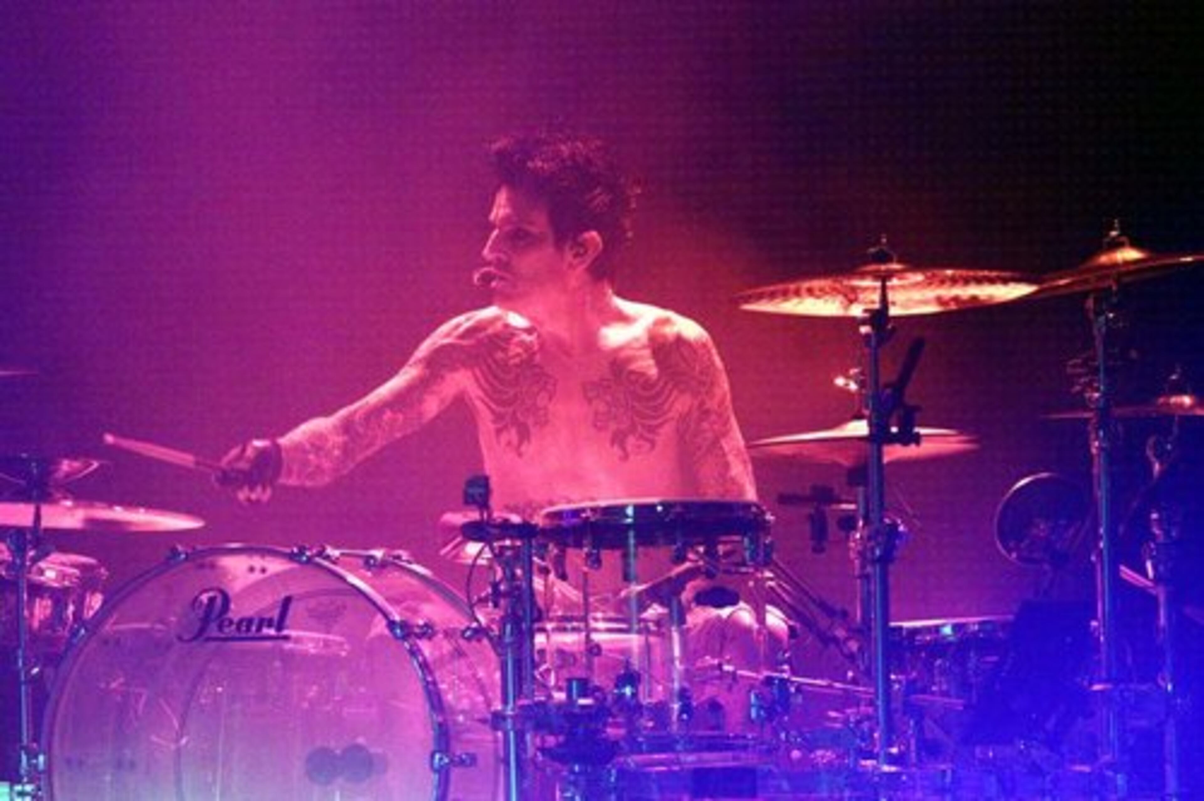 Drummer Tommy Lee and Motley Crue performing.